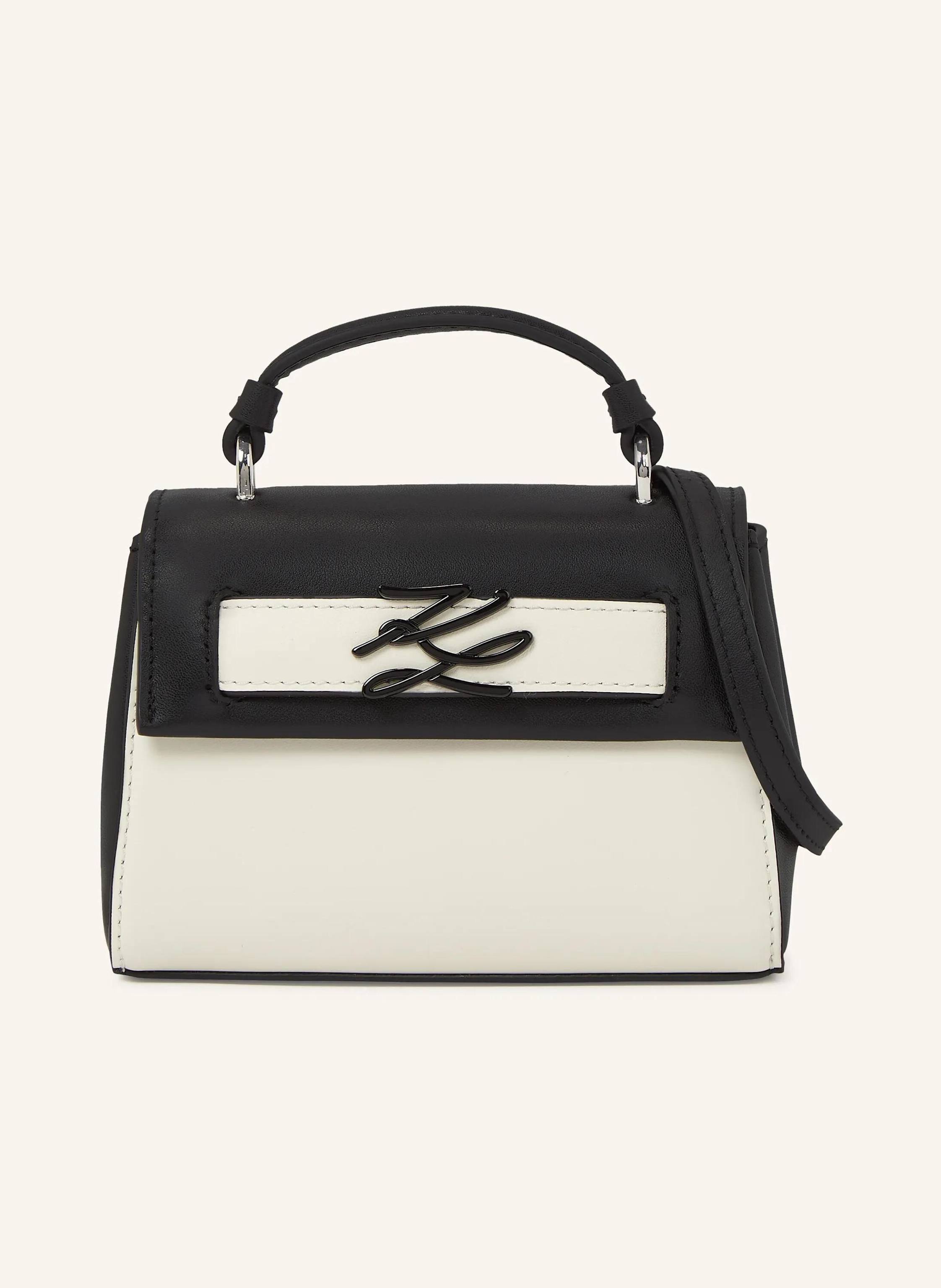 Karl Lagerfeld A petite leather crossbody bag with a bold color-block design and a flap button closure. The contrasting Karl Autograph logo adds a signature touch, perfect for day-to-night wear. Petite silhouette wi Mini in schwarz