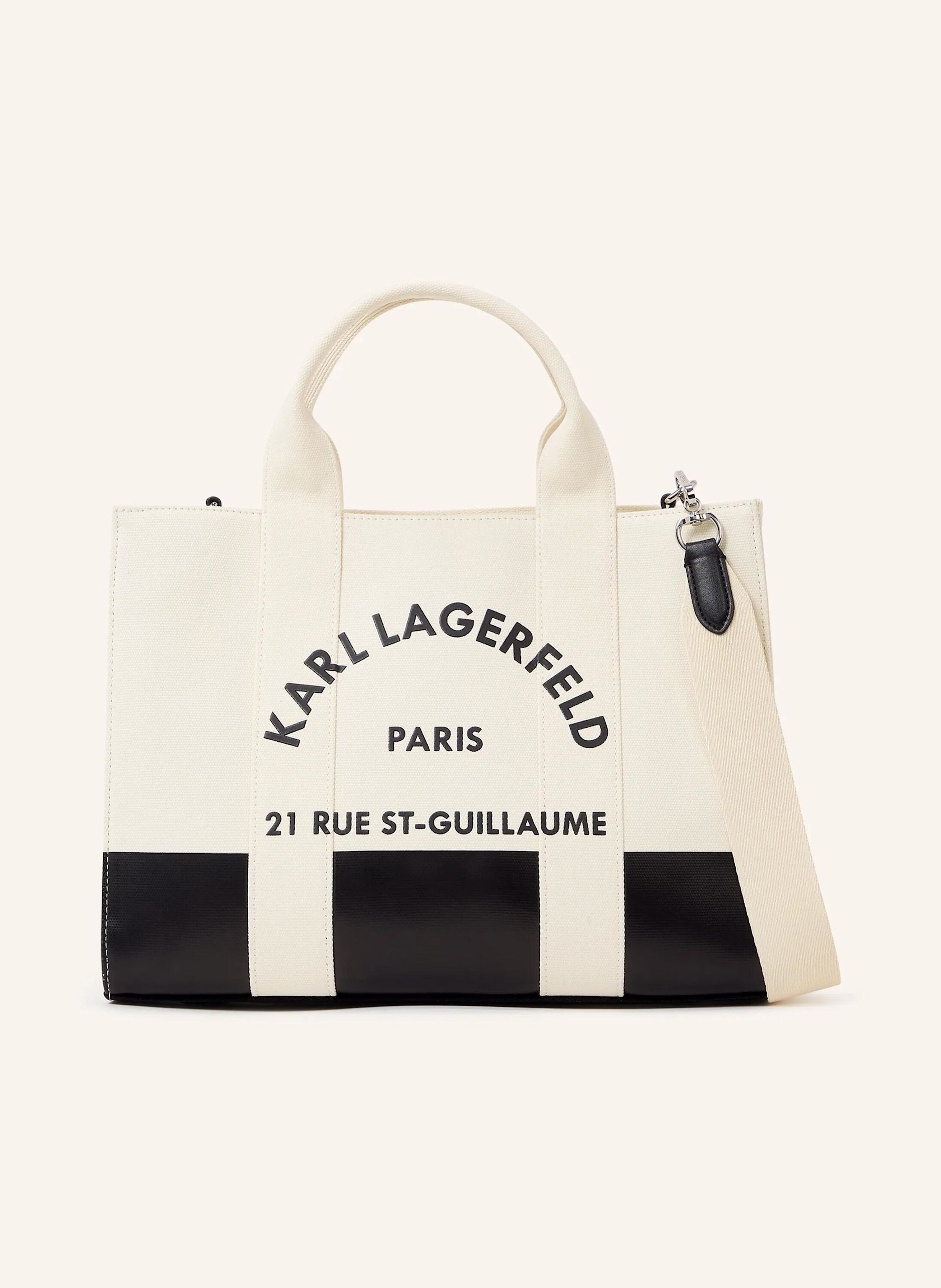 Karl Lagerfeld Eine zeitgenössische quadratische Silhouette prägt diese mittelgroße Tote-Bag mit sicherem Reißverschluss oben. Mit zwei Tragegriffen auf der Oberseite und einem abnehmbaren Riemen bietet sie vielseit in weiss/ schwarz