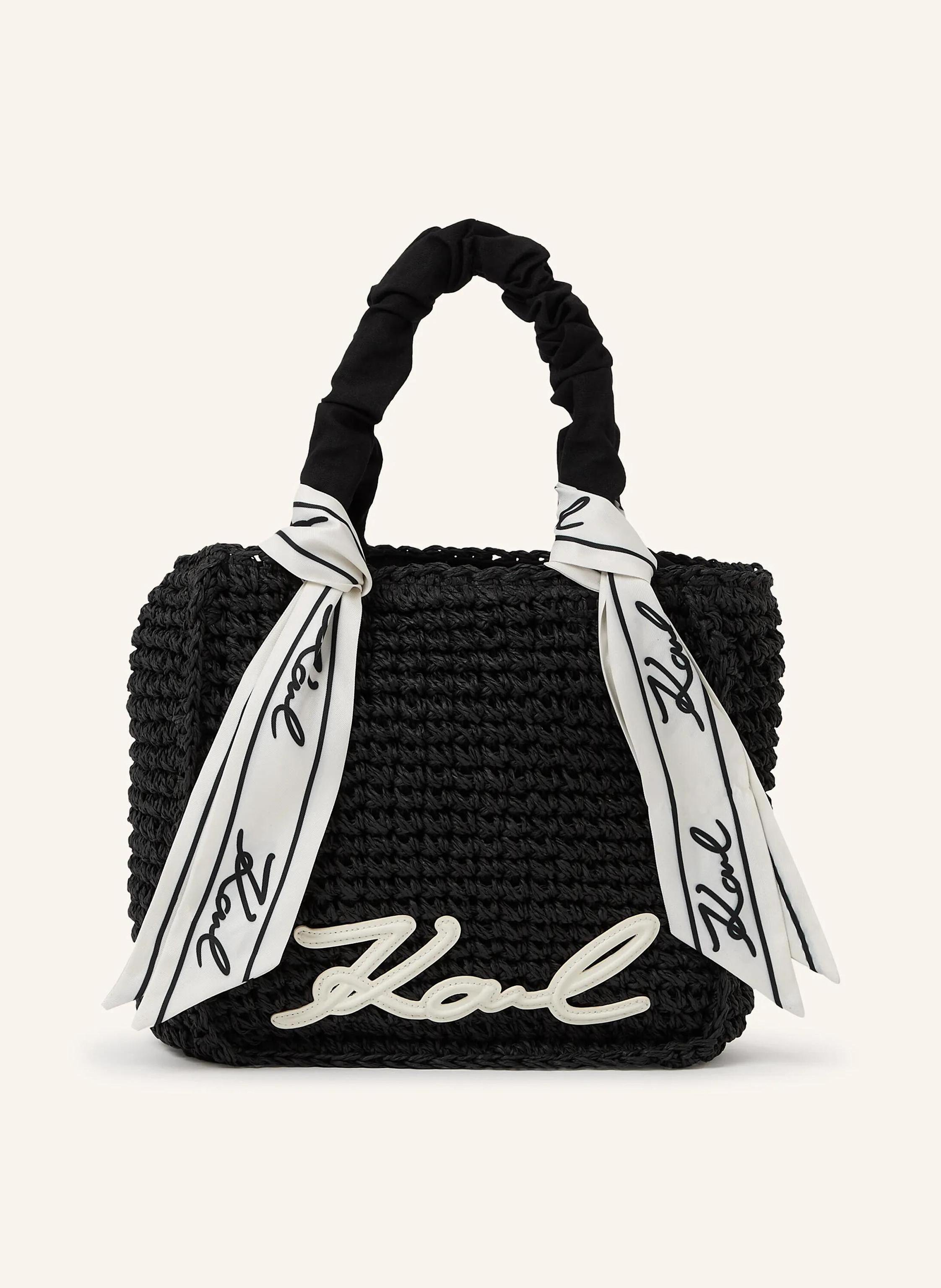 Karl Lagerfeld Sonnige Eleganz prägt diese gewebte Strandtasche, bei der strukturierte Griffe und abnehmbare Schals mühelose Stylingwechsel erlauben. Schöne Webkonstruktion und quadratische Silhouette. Strukturierte in schwarz