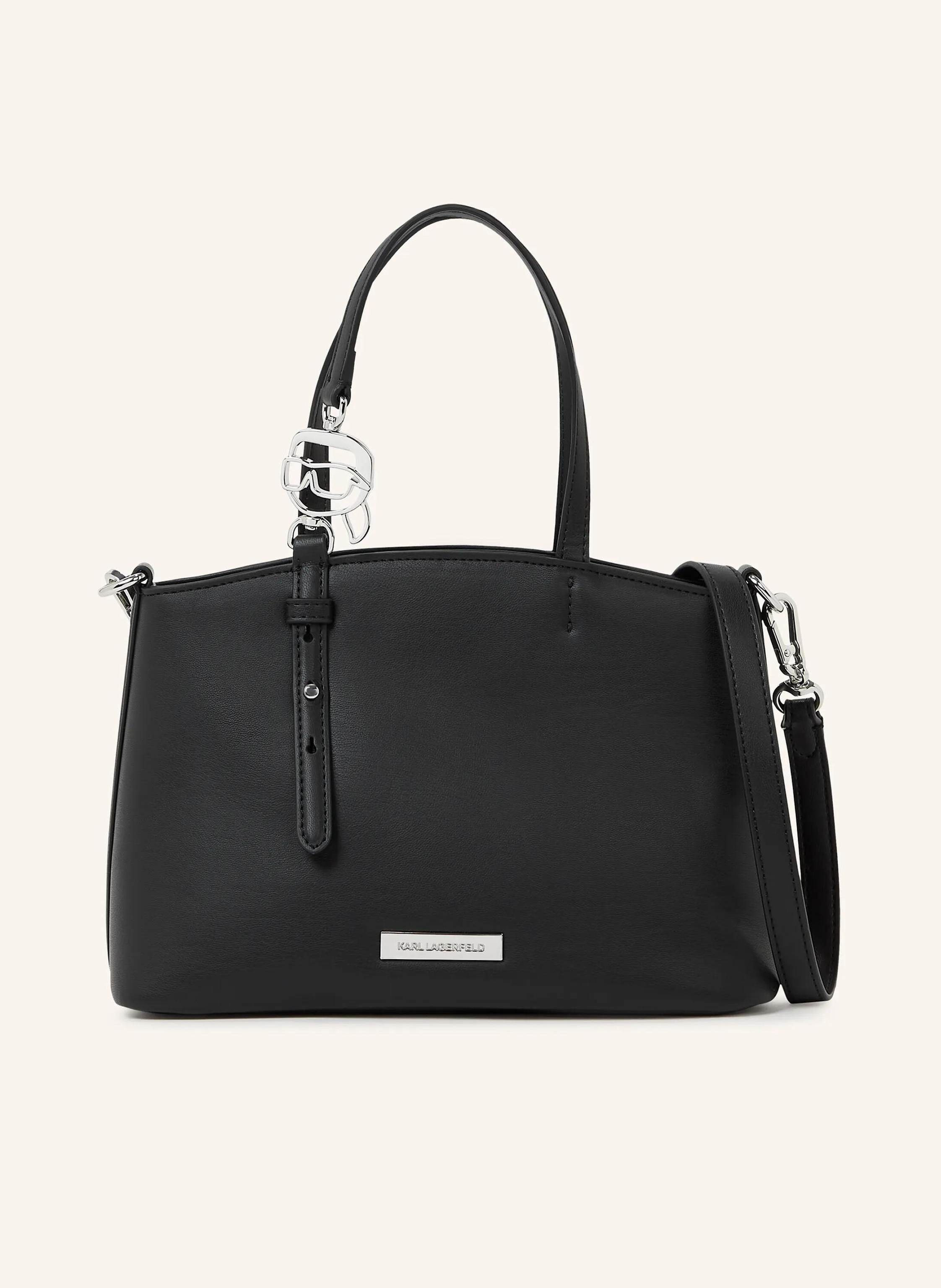 Karl Lagerfeld The Ikon small tote blends woven texture with a refined silhouette. Equipped with twin handles and a detachable strap, it offers effortless versatility from day to night. Zip-top closure to keep essen in schwarz
