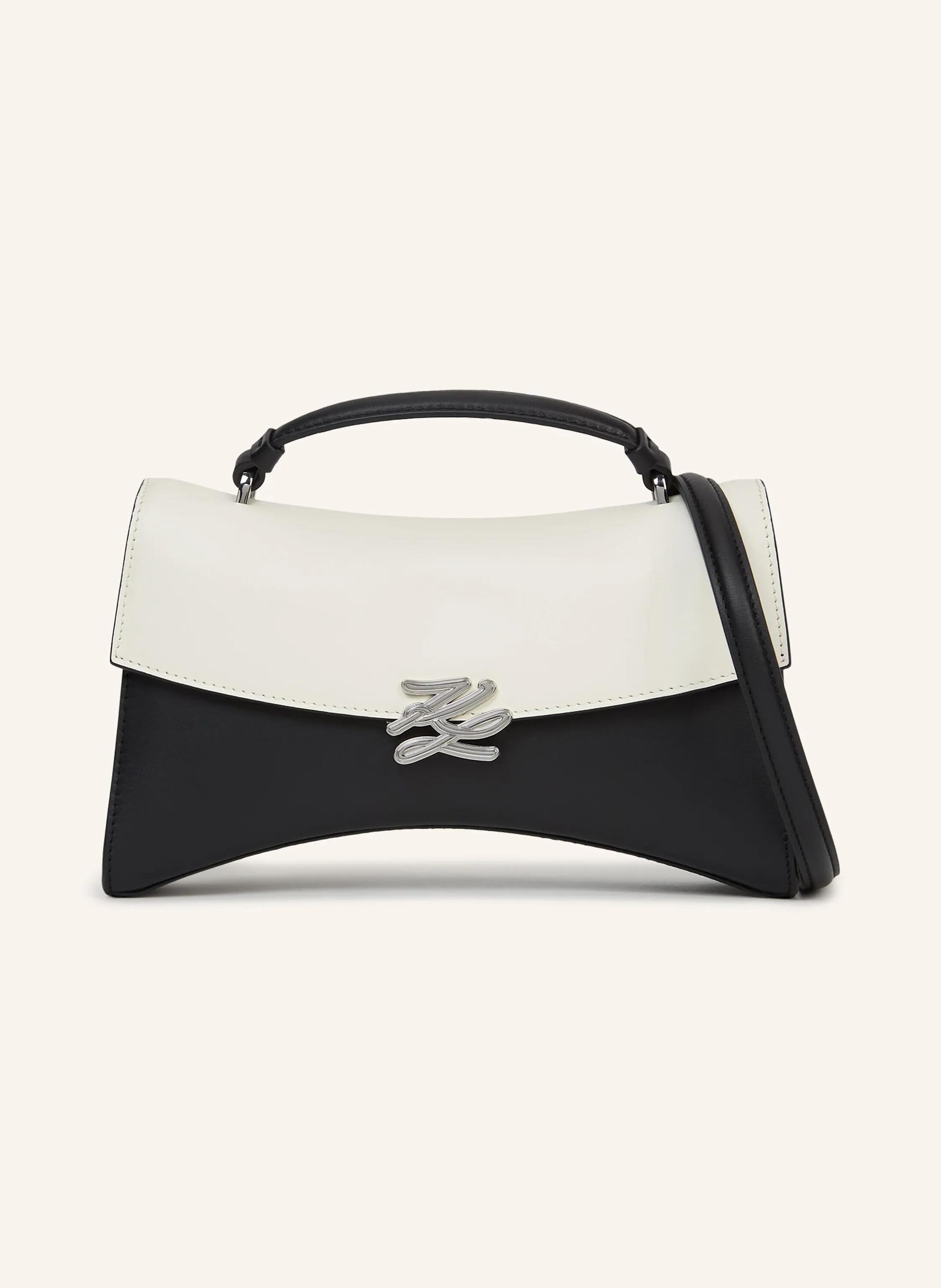 Karl Lagerfeld Diese architektonische Henkeltasche im grafischen Color-Blocking-Design ist von Karl Lagerfelds unvergesslichen Ballett- und Opernkostümen inspiriert. Die elegante Überschlagklappe hält Wichtiges sich in schwarz