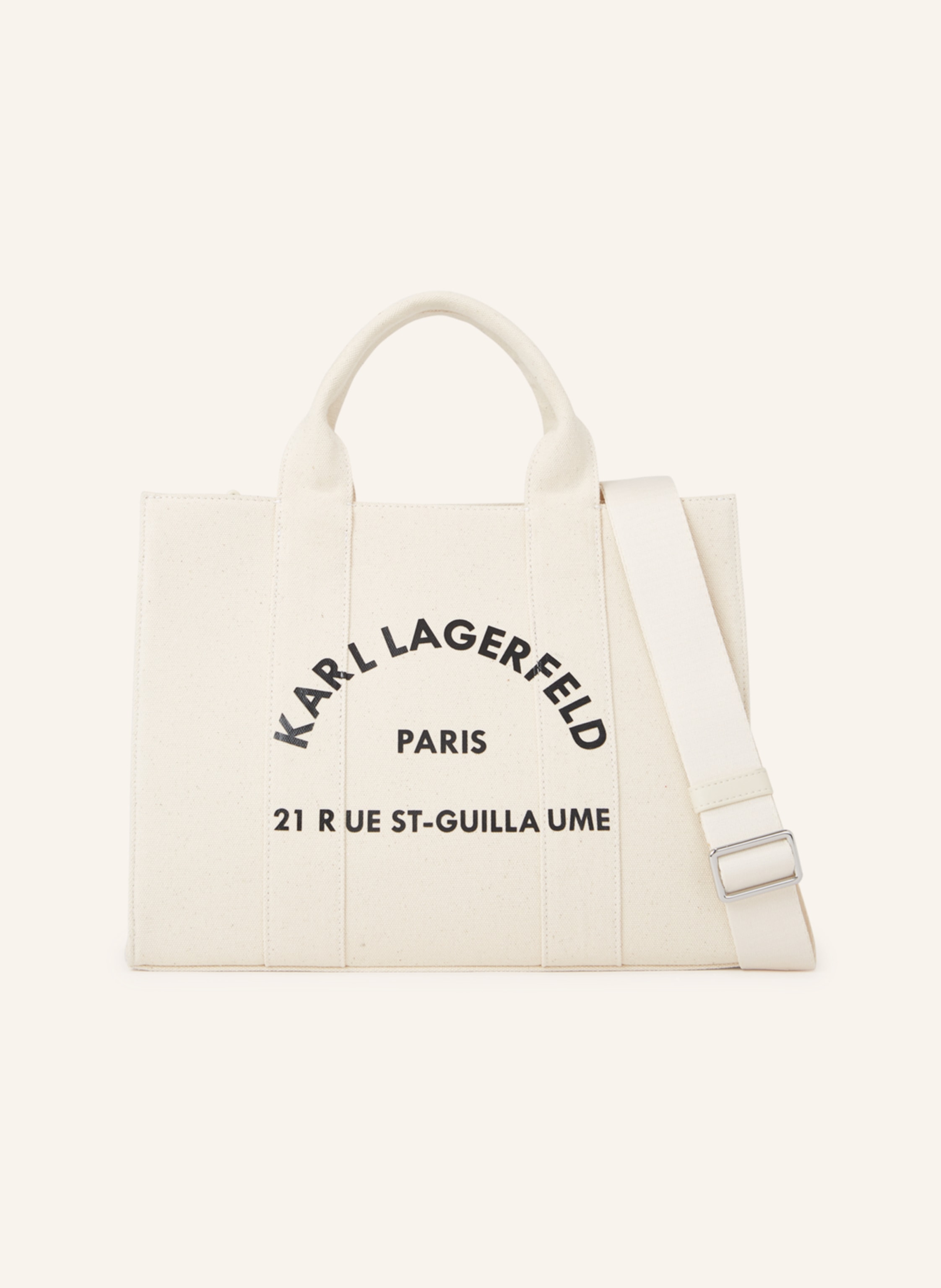 Karl Lagerfeld Ihre neue Lieblings-Tragetasche ist da. Nehmen Sie diese quadratische Tasche mit ins Büro, zum Brunch oder auf einen schicken Kurzurlaub übers Wochenende. Verstärkte, doppelte Tragegriffe. Abnehmbarer in beige