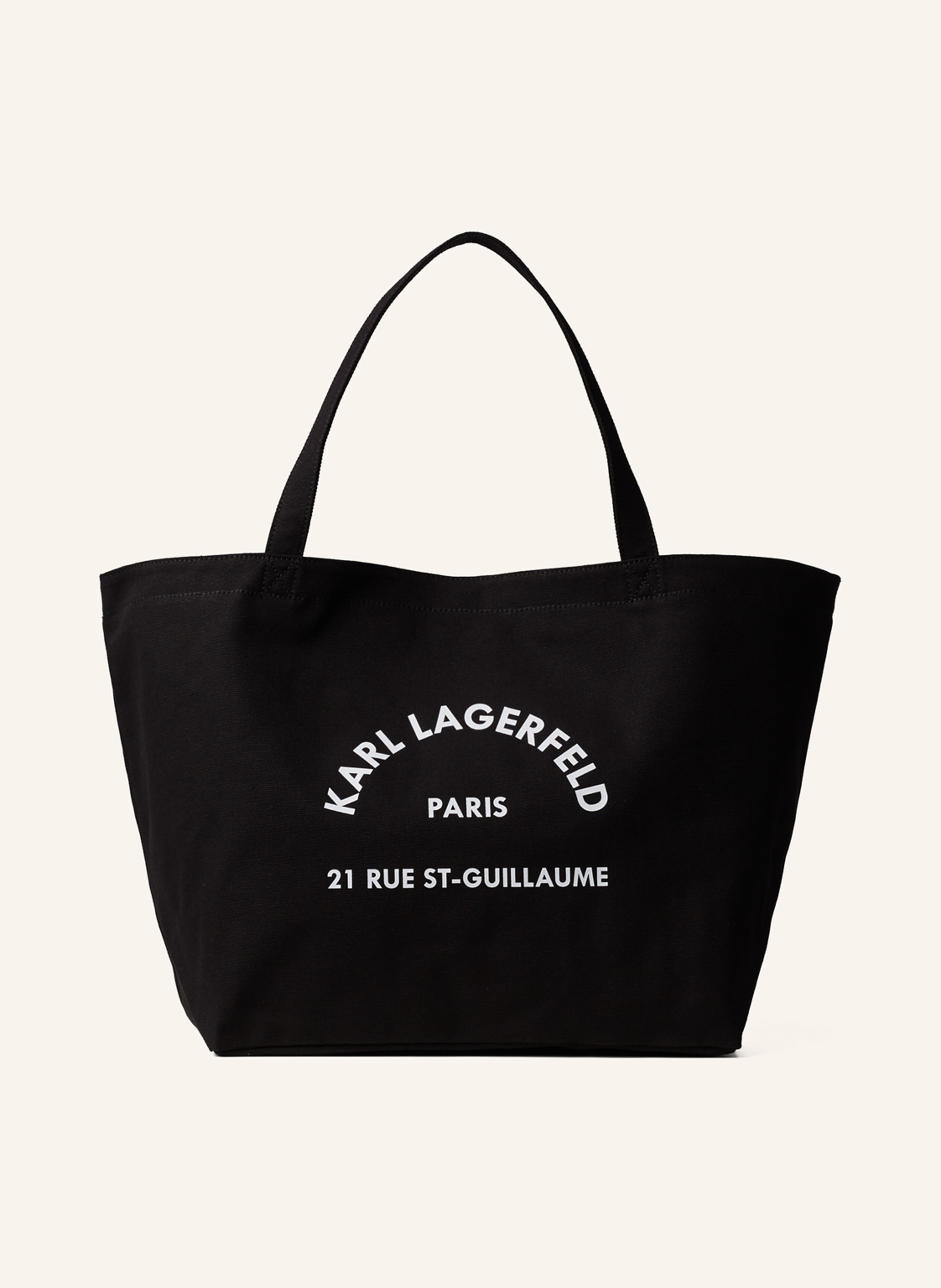 Karl Lagerfeld Der berühmte Rue St-Guillaume Logo-Print macht die geräumige Tote Bag aus Canvas zu einem Lieblingsaccessoire im unverwechselbaren KARL Look. Magnetischer Knopfverschluss. Tragegriffe. KARL Rue St-Gui in schwarz