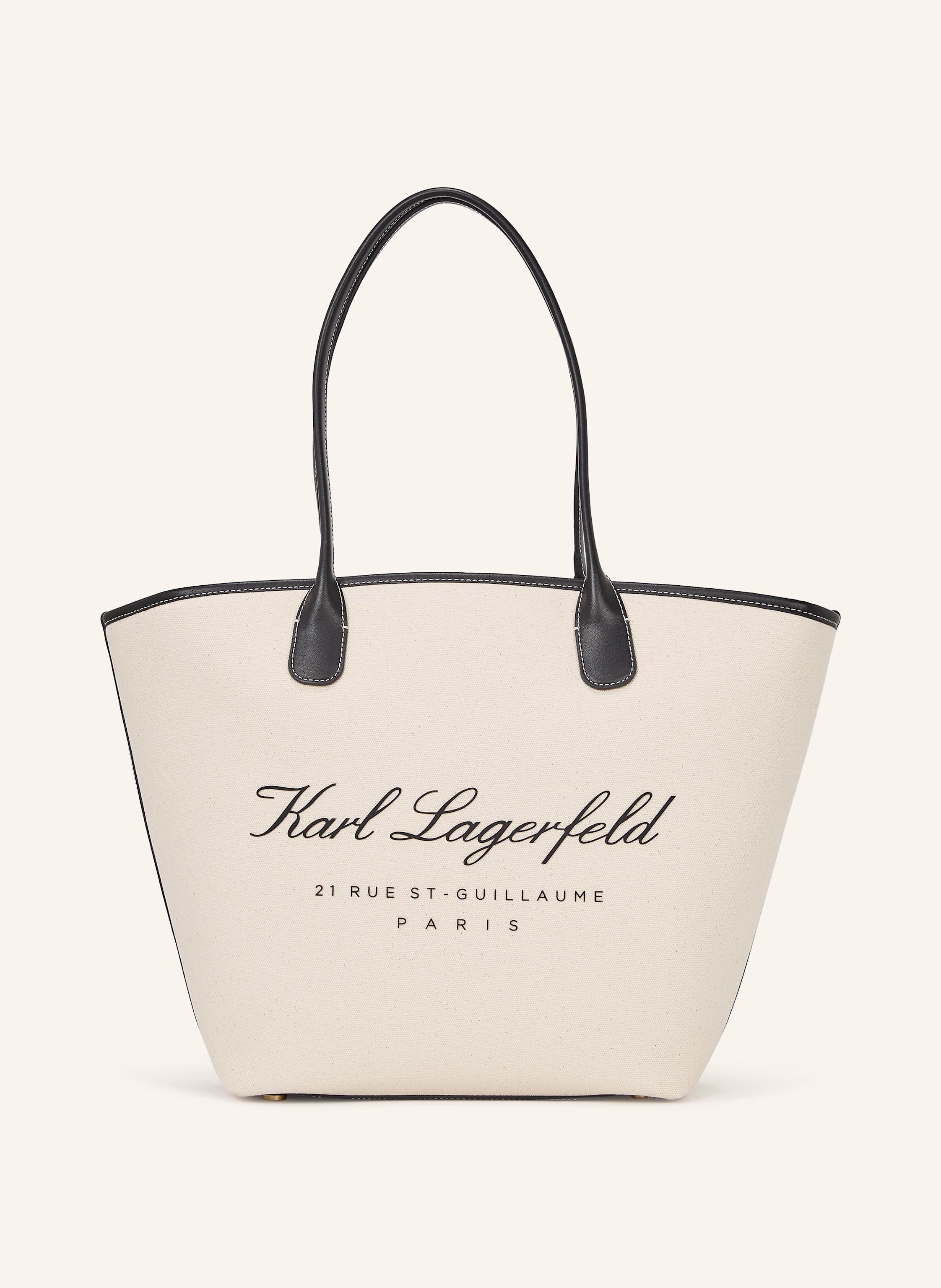 Karl Lagerfeld Diese mittelgroße Tote-Bag aus Canvas verleiht Ihrer Urlaubsgarderobe ein neues Maß an Raffinesse. Die beiden strukturierten Tragegriffe und die kontrastierenden Einfassungen kreieren einen klassische in beige