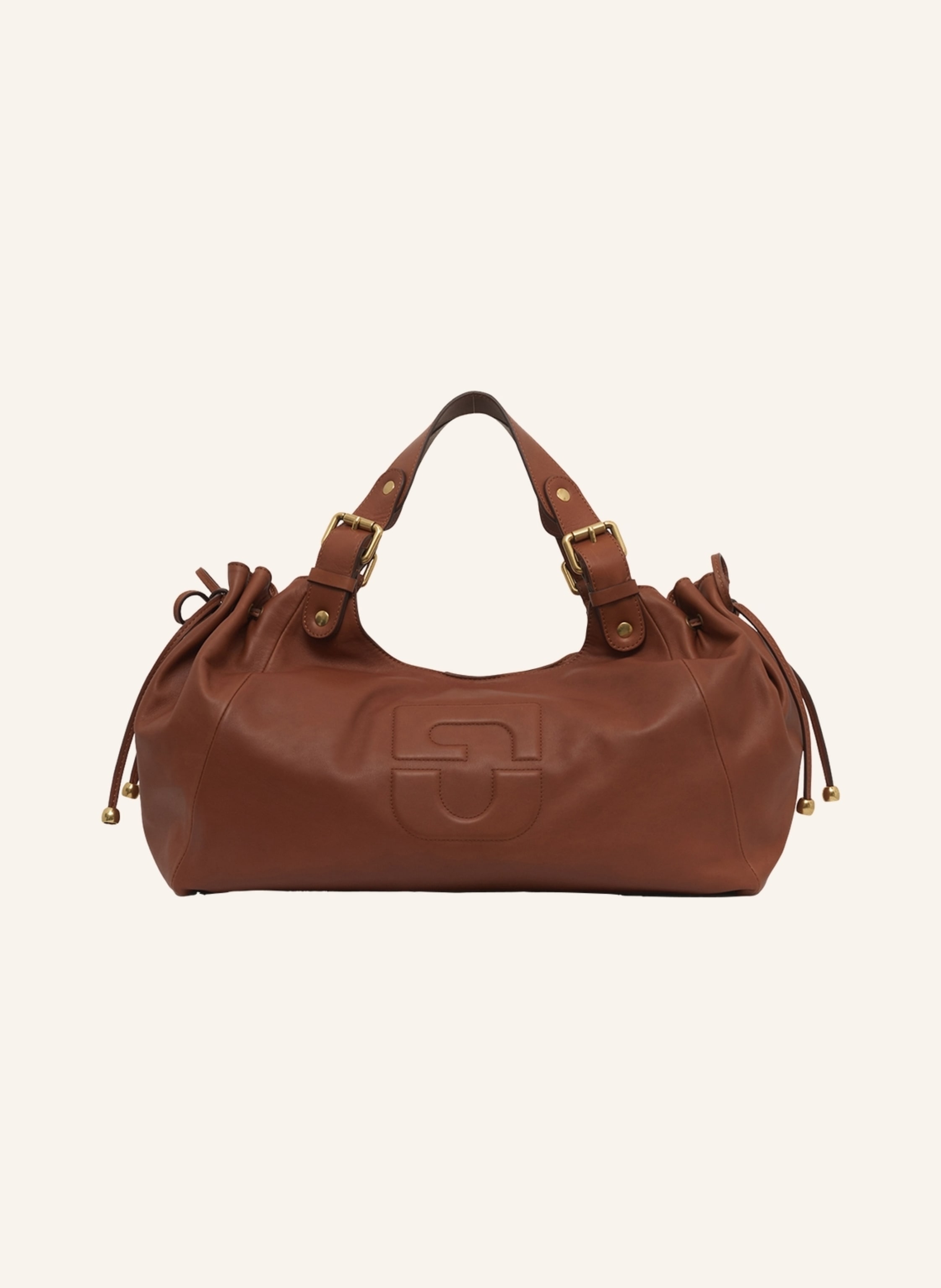 Gerard Darel Die Handtasche CHIARA GD aus ikonischem Darel-Leder zeichnet sich durch ihre natürliche Drapierung mit einer neuen Interpretation der Signaturen des Hauses Darel aus. Sie verkörpert einen modernen, di in braun