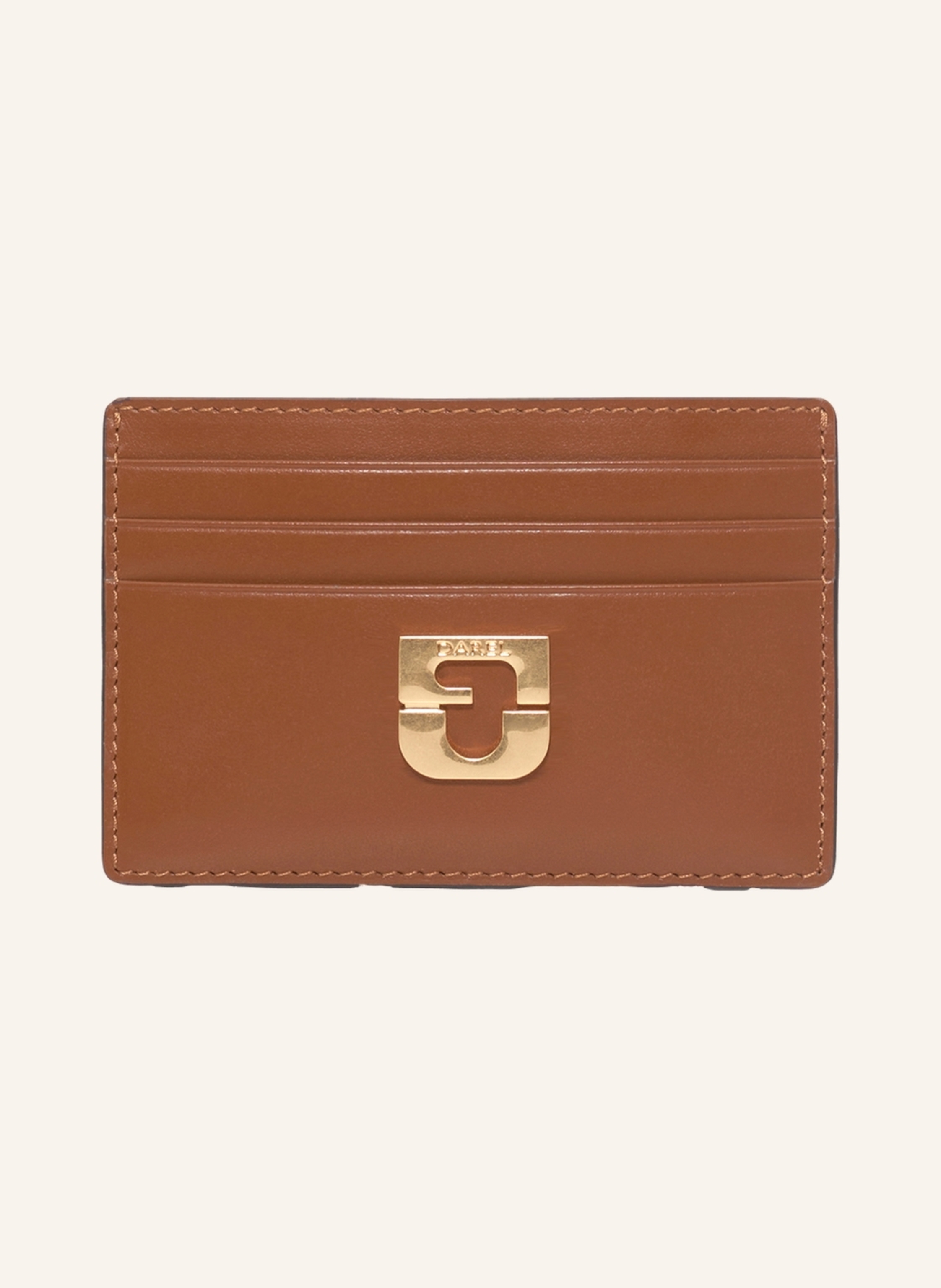Gerard Darel Ein echtes Objekt der Begierde, das durch sein minimalistisches Design und seine klaren Linien besticht. Es vereint Praktikabilität und Raffinesse. Aus Kalbsleder gefertigt und mit den goldenen Initia in cognac