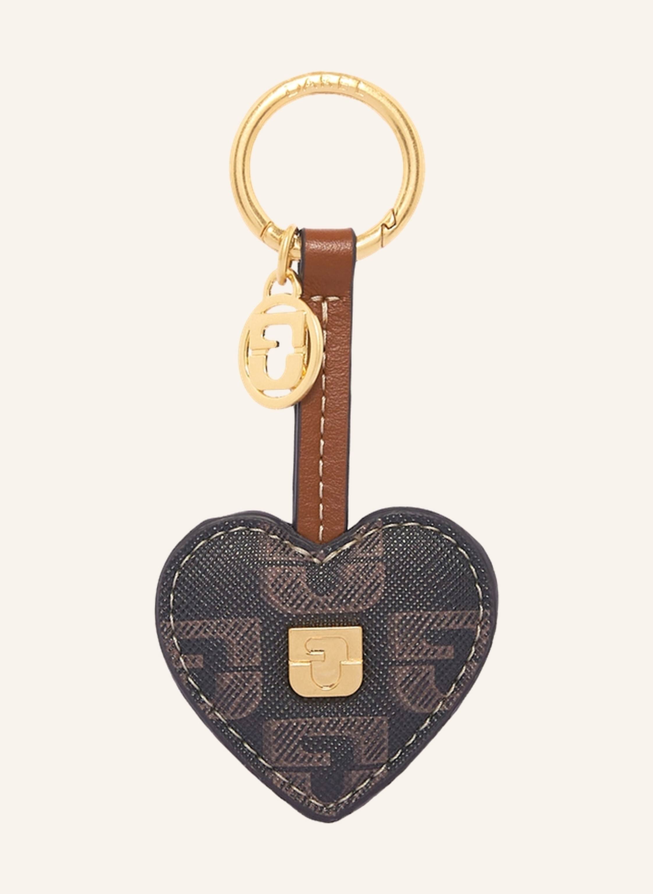 Gerard Darel Schlüsselanhänger in Herzform, entworfen aus coated Monogrammstoff und Leder, bereichert mit einer GD-Medaille, verleiht Ihren Essentials einen Hauch von Charme und Zartheit. Er lässt sich mühelos an in braun