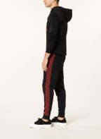 HUGO Sweatpants DACINO mit Galonstreifen, Farbe: SCHWARZ/ ROT (Bild 1)