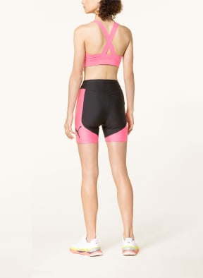 PUMA Sports bra FIT MID IMPACT in neon pink