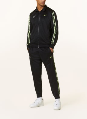 Nike sweatpants online with zipper