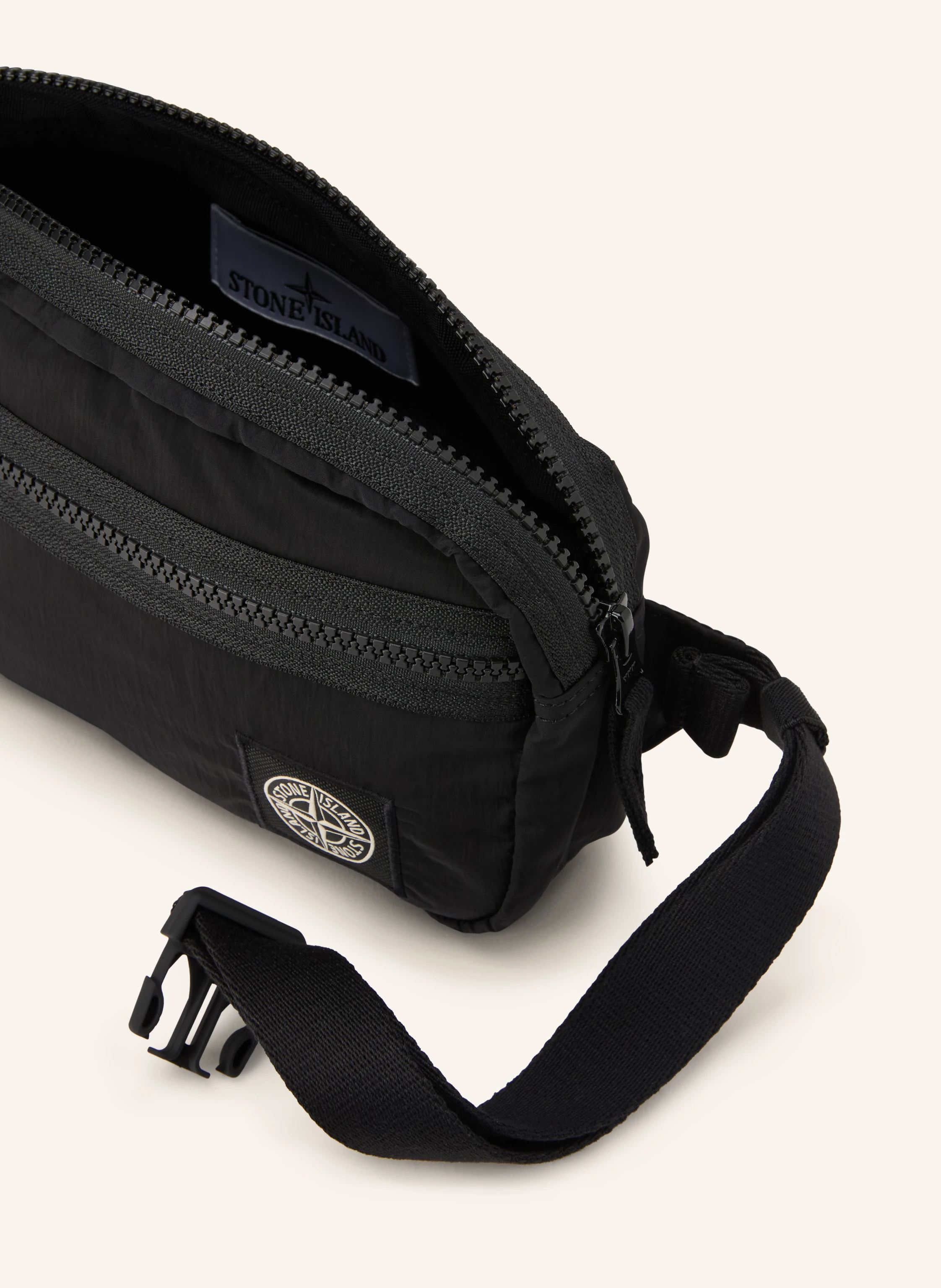 STONE ISLAND fanny pack can be worn as a shoulder bag in black