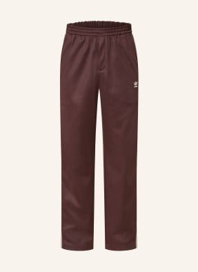 Adidas Originals Tepláky Wb Track Pant tmavě červená / režná
