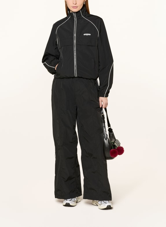 TOMMY JEANS tréninková bunda ČERNÁ / BÍLÁ