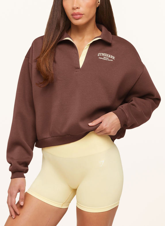 GYMSHARK Polo-sweat COSY LUXE CAMPUS MARRON FONCÉ / JAUNE CLAIR