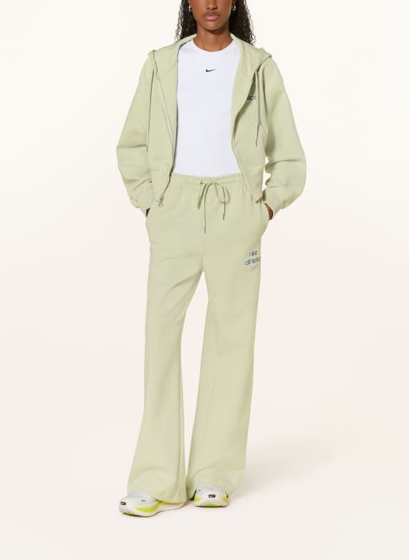 Nike Spodnie dresowe SPORTSWEAR PHOENIX FLEECE JASNOZIELONY
