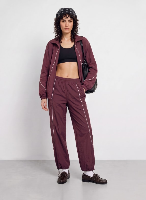 UNDER ARMOUR Trackpants UA UNSTOPPABLE DONKERROOD / WIT