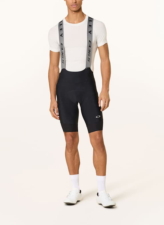 OAKLEY Fietsbroek Q36.5 GRIDSKIN BIBSHORT met bandjes en gewatteerde inzetstukken ZWART