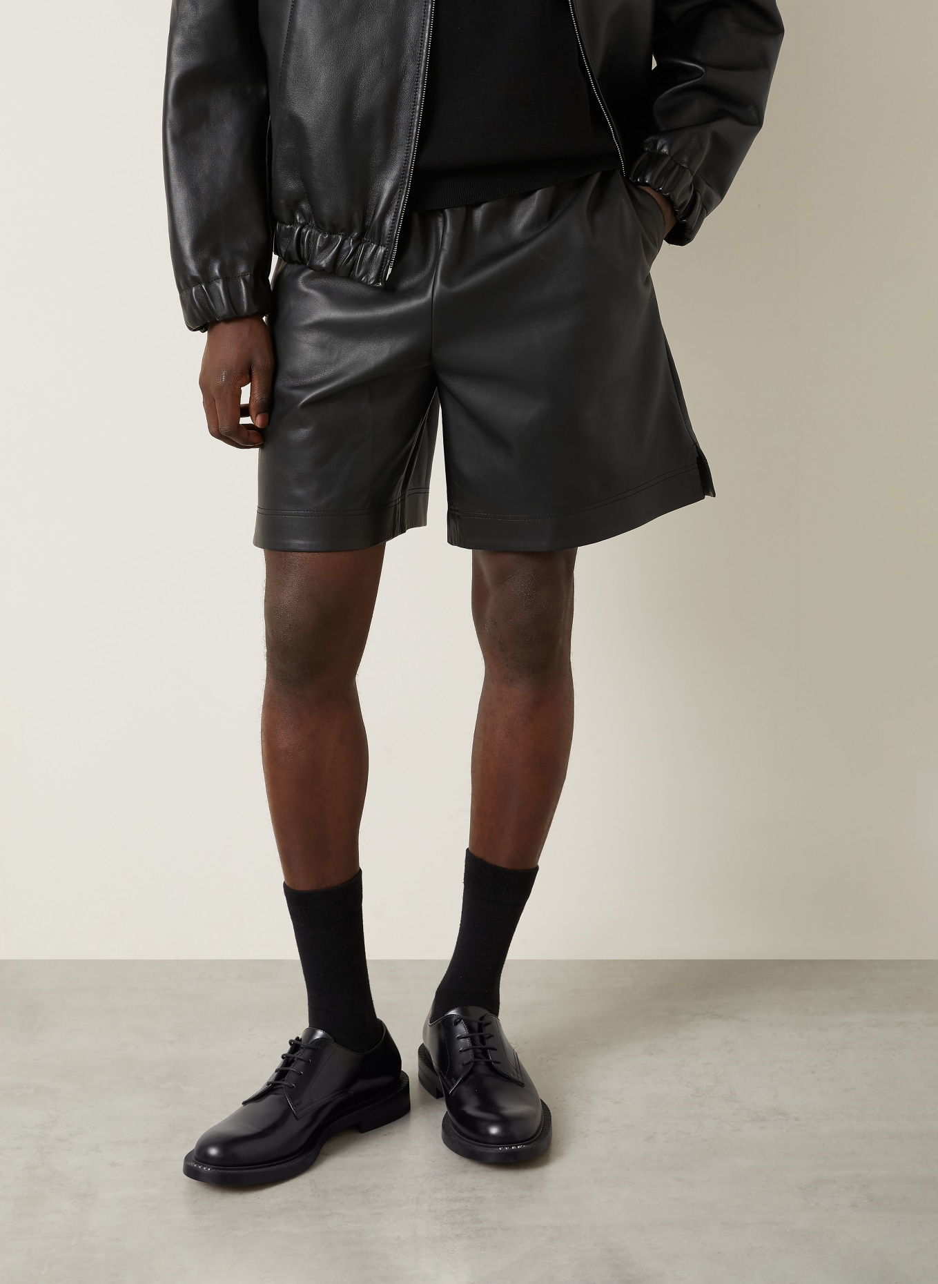 GUCCI leather shorts: BLACK