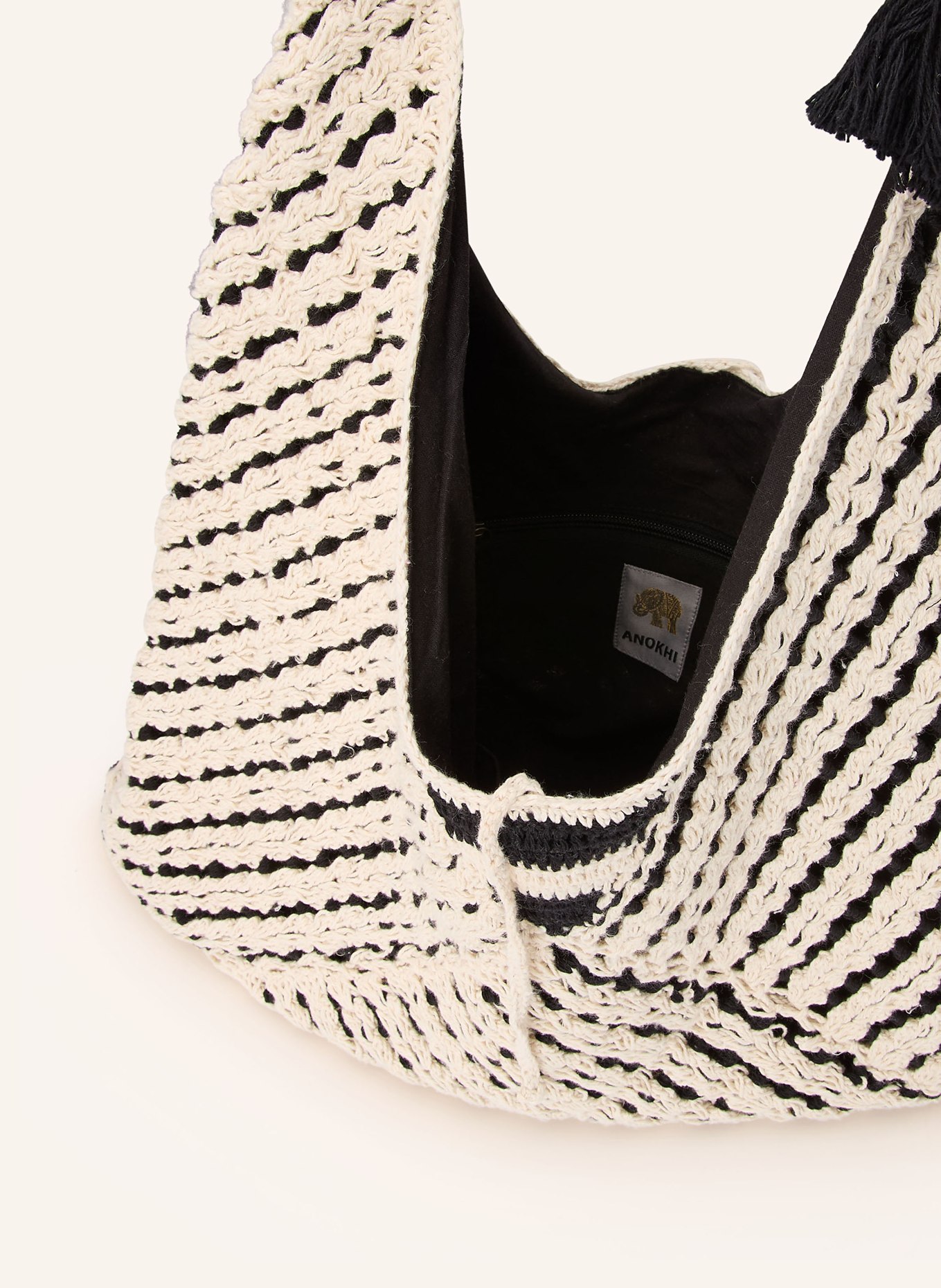 ANOKHI Schultertasche: CREME / SCHWARZ