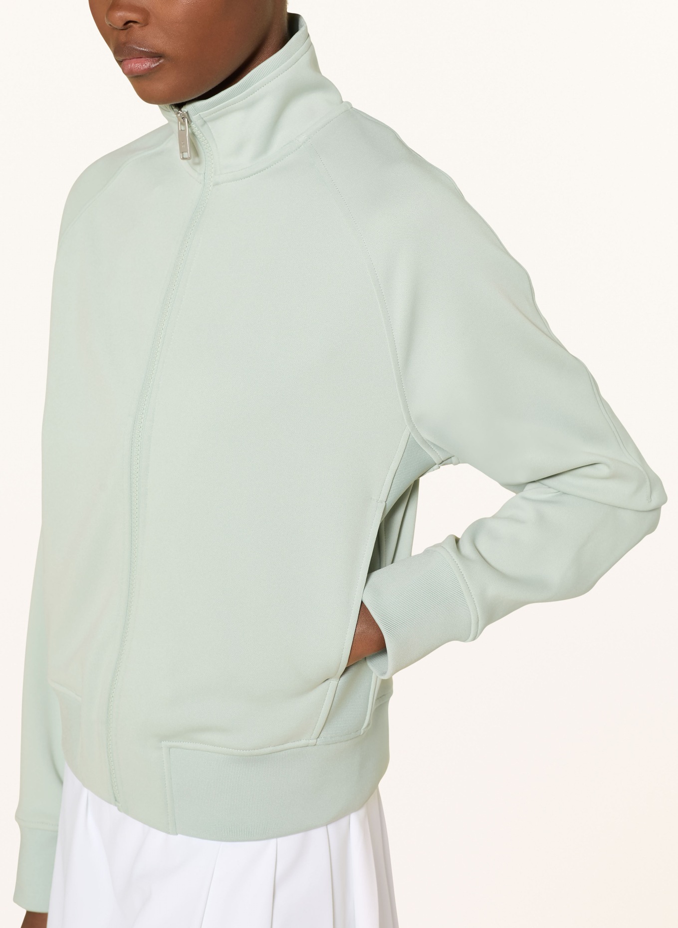 On COURTSIDE training jacket: LIGHT GREEN