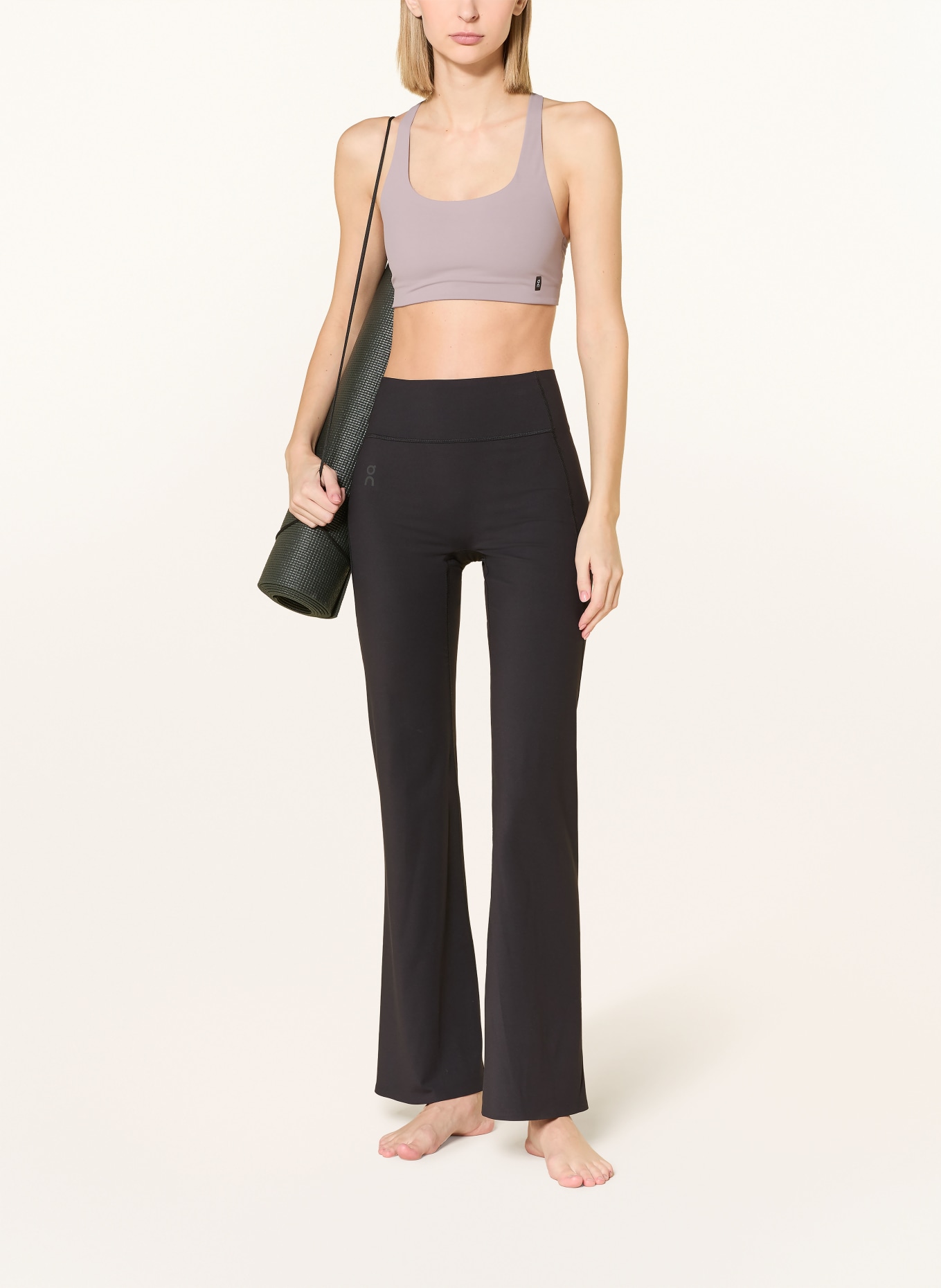 On STUDIO sports bra: LIGHT PURPLE