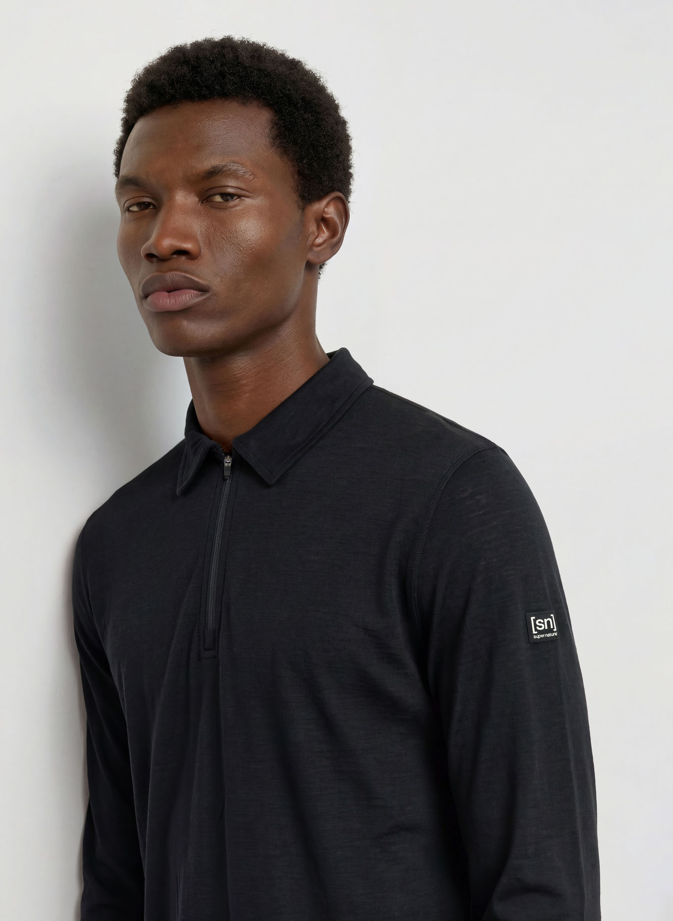 super.natural Functional polo shirt with merino wool: BLACK