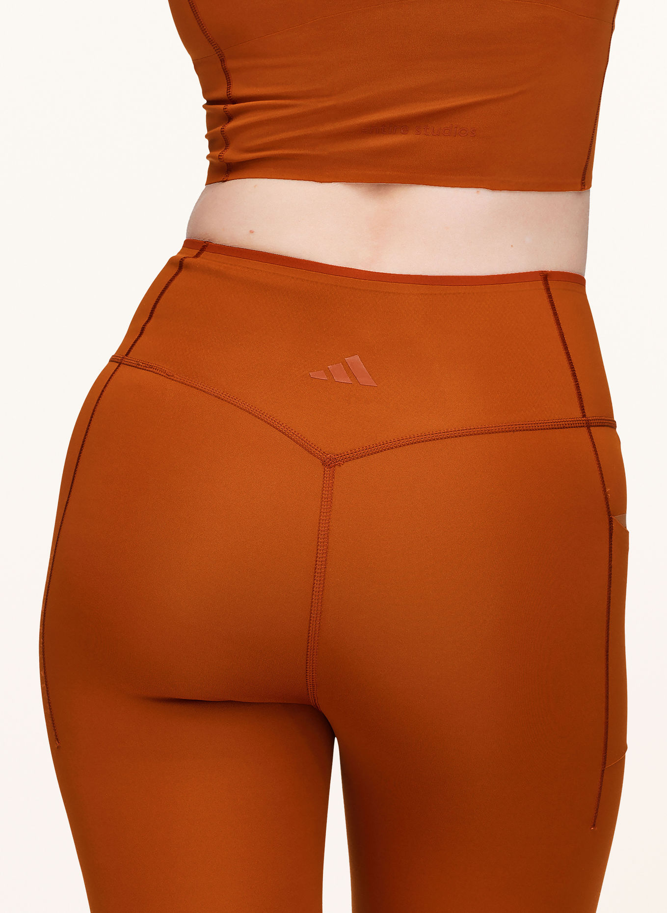 adidas Legíny ADIDAS X ENTIRE STUDIOS ESSENTIALS OPTIME: TMAVĚ ORANŽOVÁ