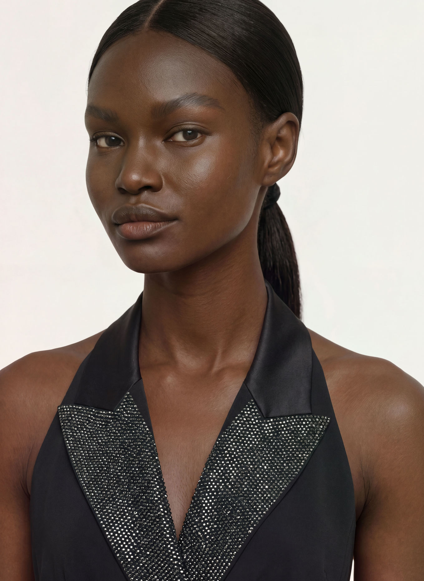 RIANI Wrap-style jumpsuit with rhinestones: BLACK