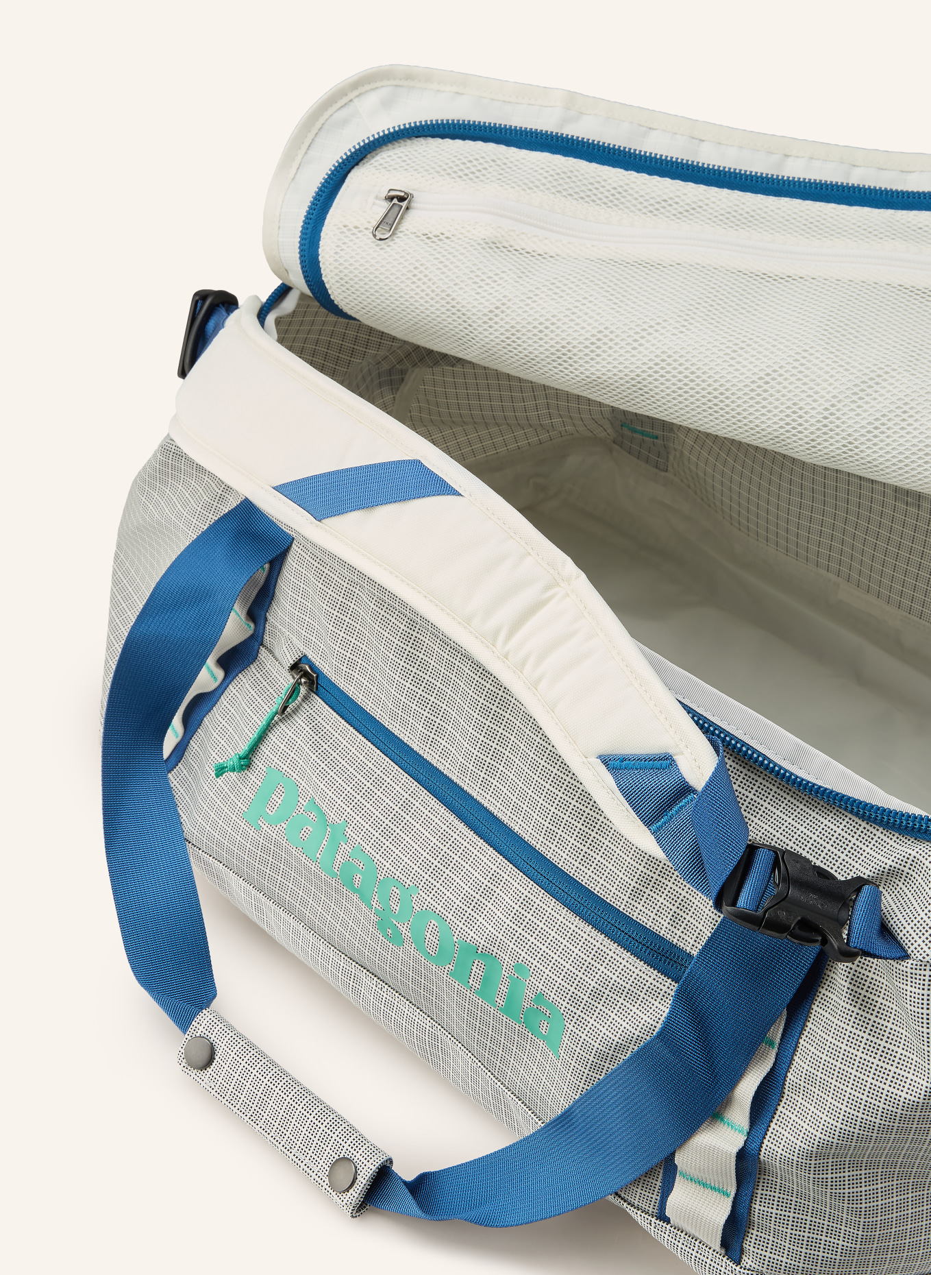 patagonia Cestovní taška BLACK HOLE® 40 l: KRÉMOVÁ / ZELENÁ / MODRÁ