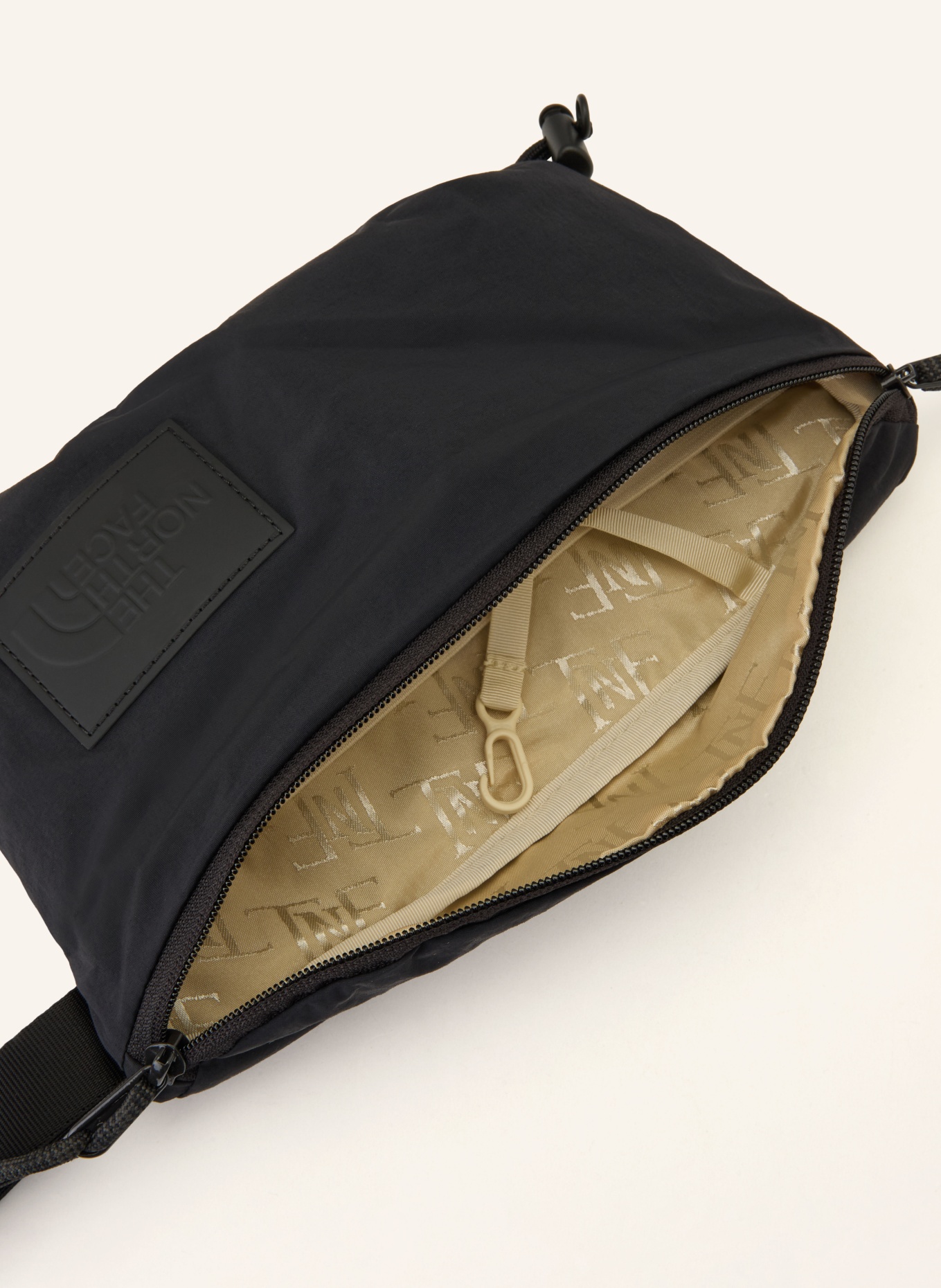 THE NORTH FACE Pásková taška NEVER STOP: TMAVĚ ŠEDÁ