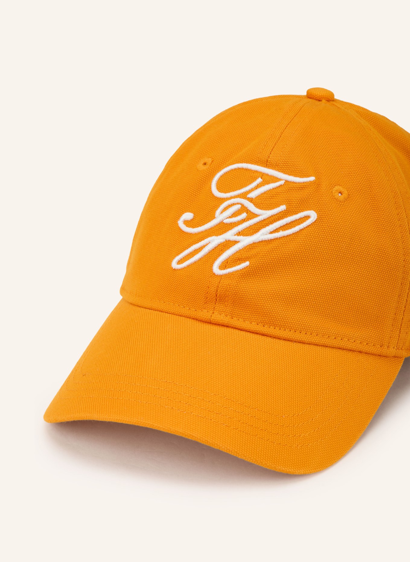TOMMY HILFIGER Cap: ORANGE / WEISS