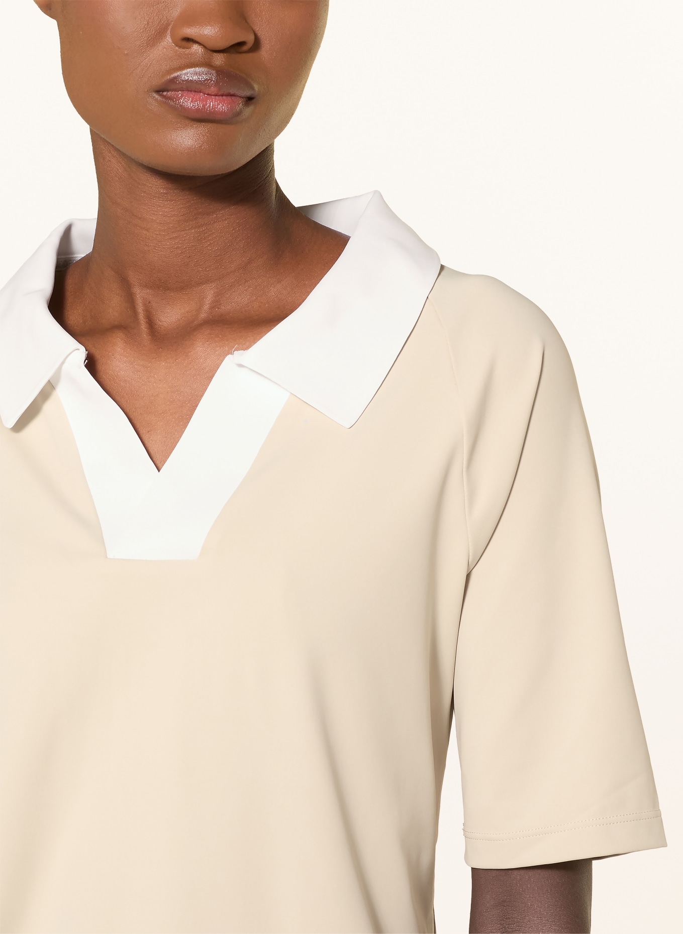 GOLDBERGH Functionele polo PICCOLA: LICHTBRUIN / WIT