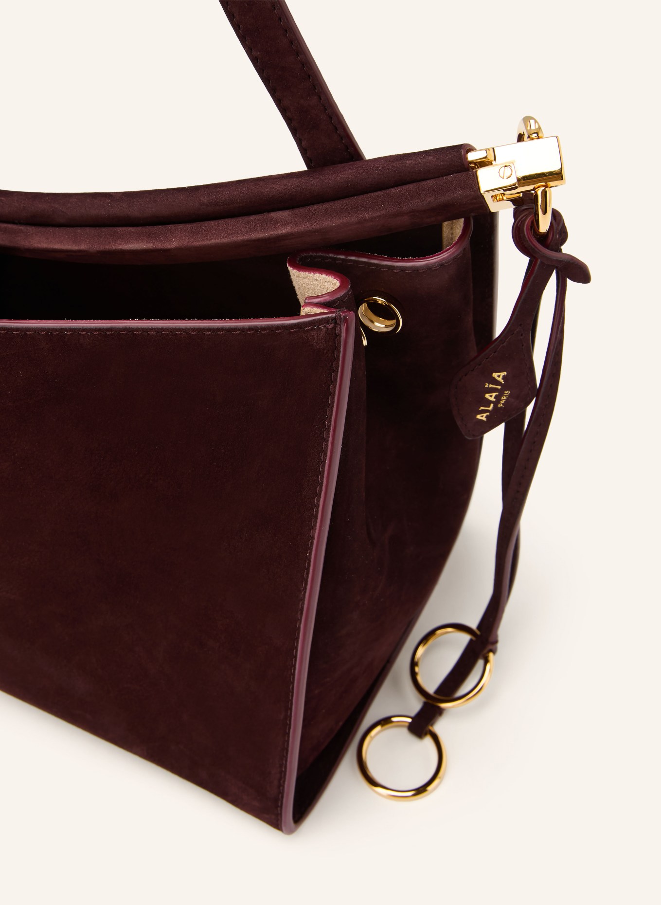 ALAÏA Handtas LE CLICK POCKET 35: MARRON FONCÉ / GOUD