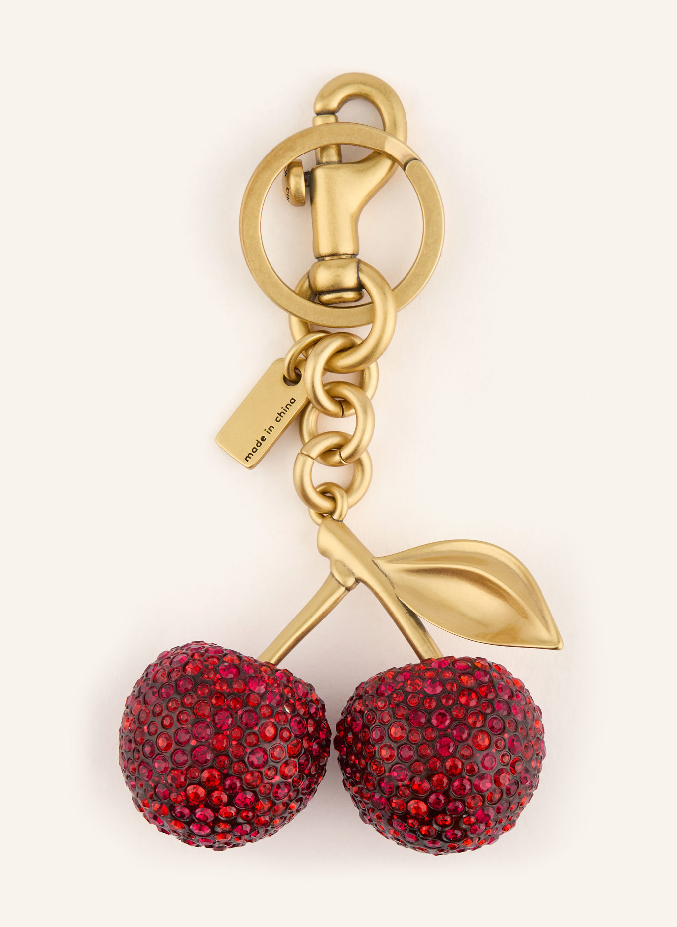 COACH Sleutelhanger met sierstenen: ROOD / GOUD