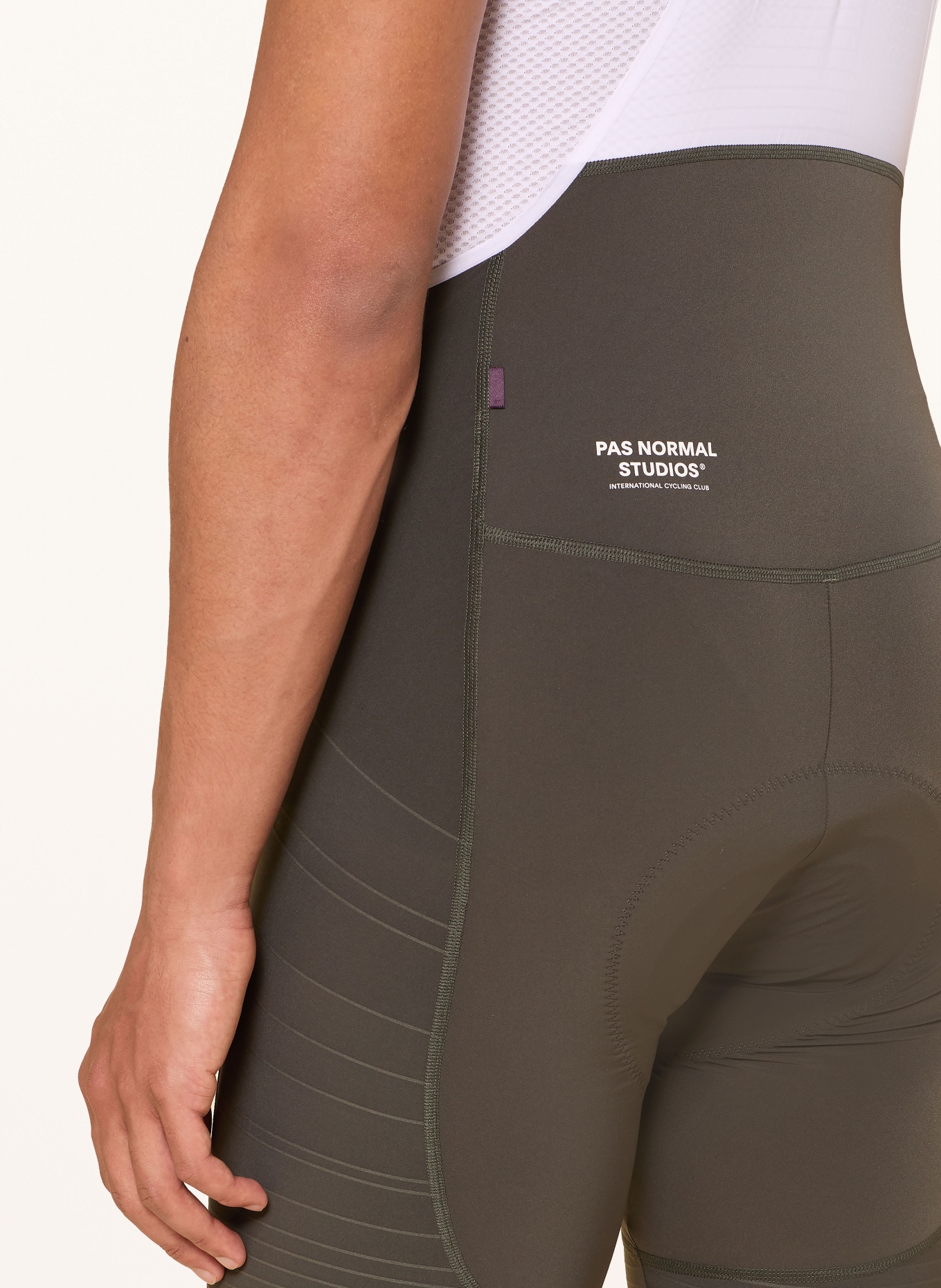 PAS NORMAL STUDIOS Cycling shorts MECHANISM PRO with straps and padded insert: WHITE / OLIVE