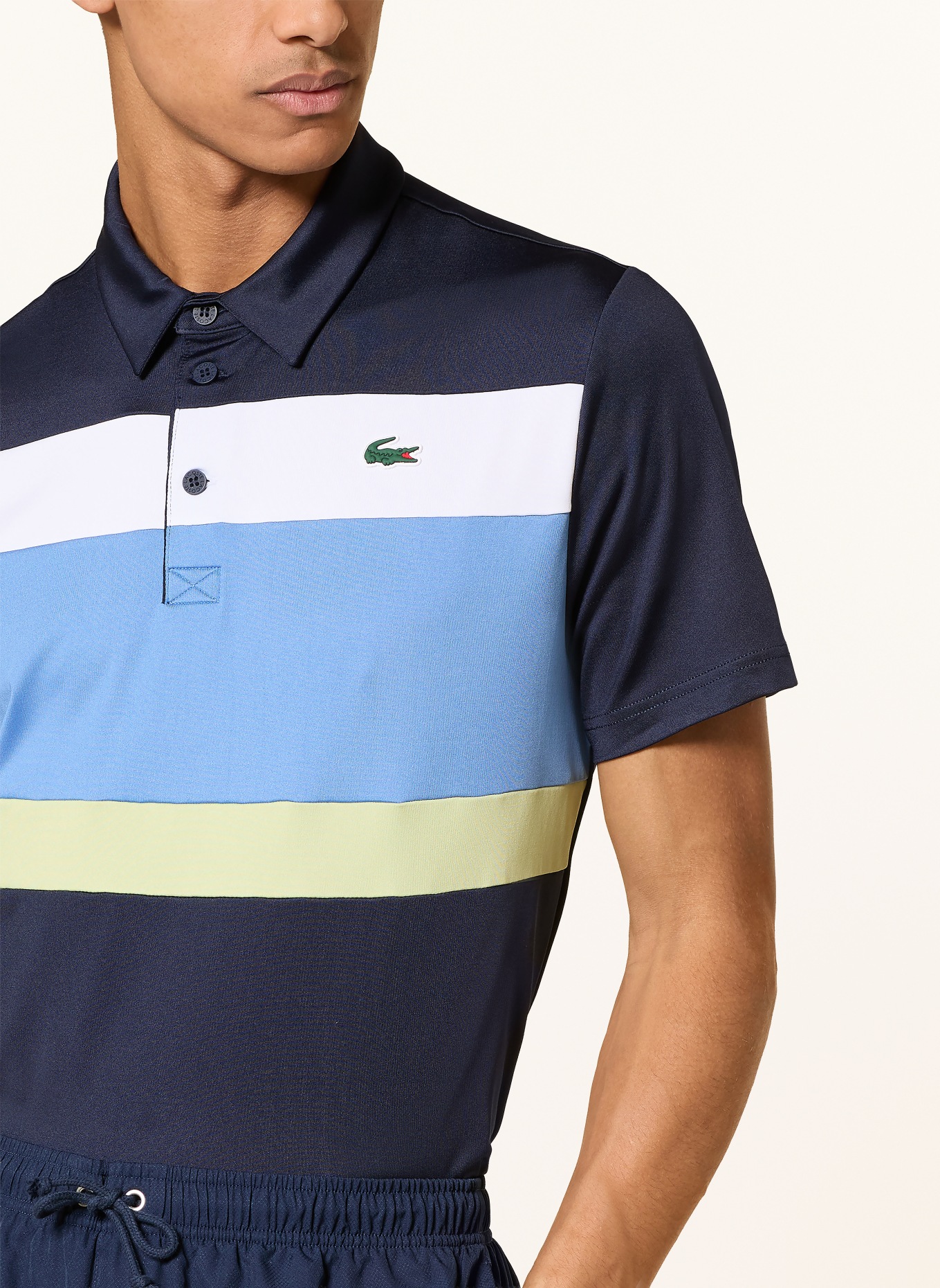 LACOSTE Polo fonctionnel: BLEU FONCÉ / VERT CLAIR / BLANC