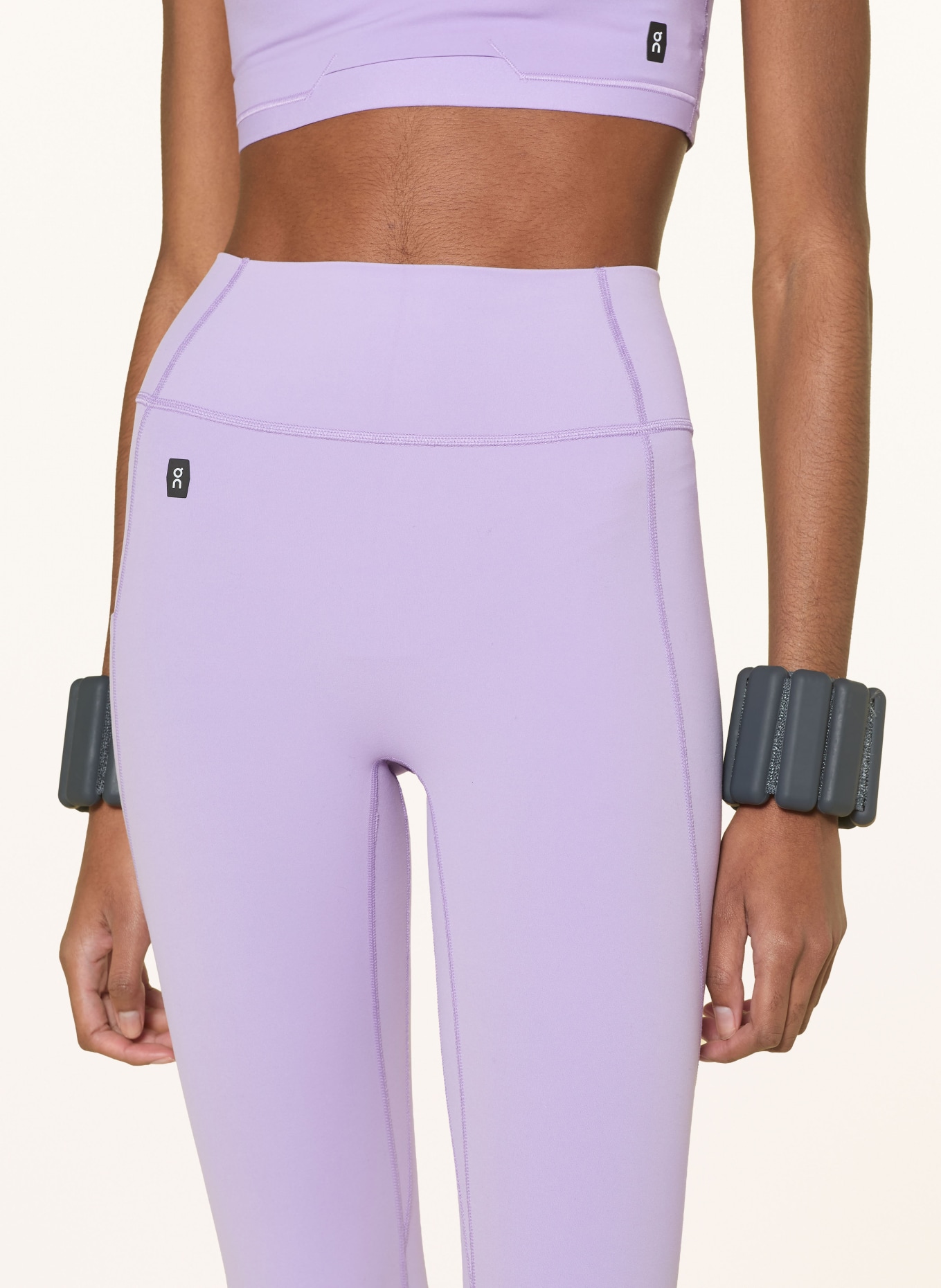 On STUDIO Tights: LIGHT PURPLE