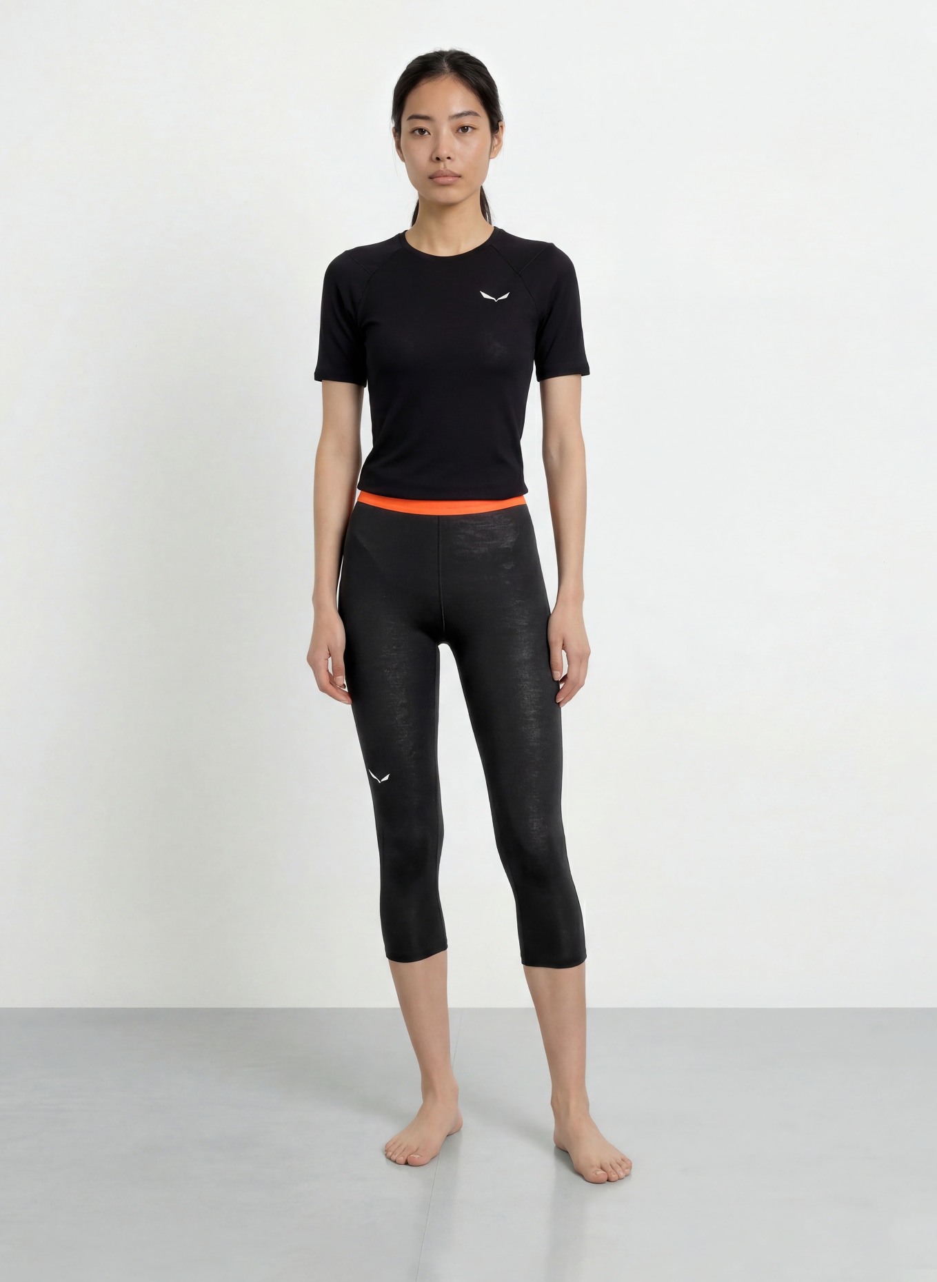 SALEWA Pantalon fonctionnel CRISTALLO en laine mérinos, longueur raccourcie: NOIR / ORANGE FLUO