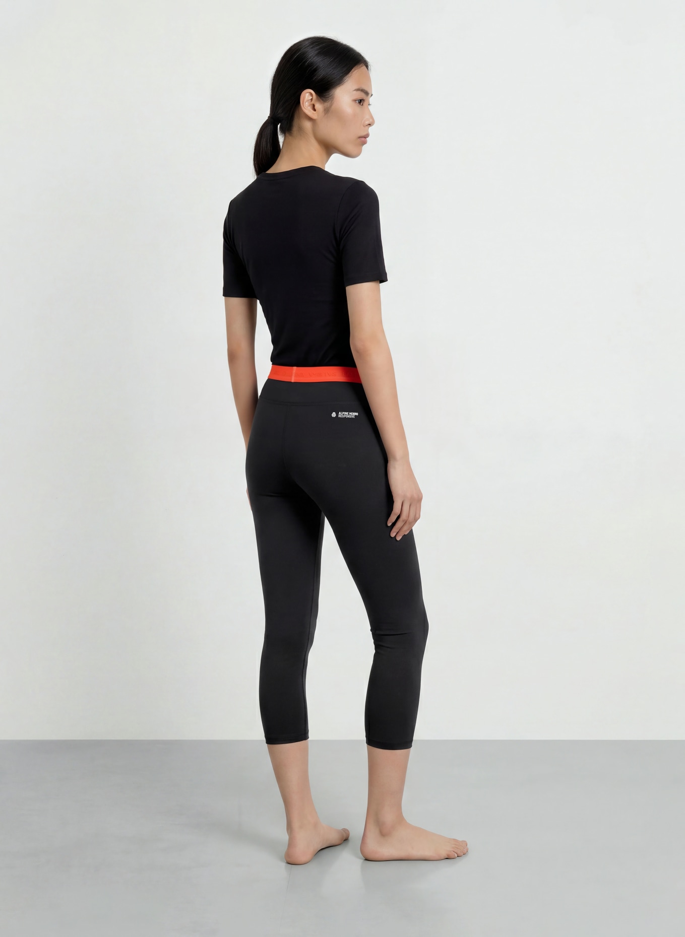 SALEWA Pantalon fonctionnel CRISTALLO en laine mérinos, longueur raccourcie: NOIR / ORANGE FLUO