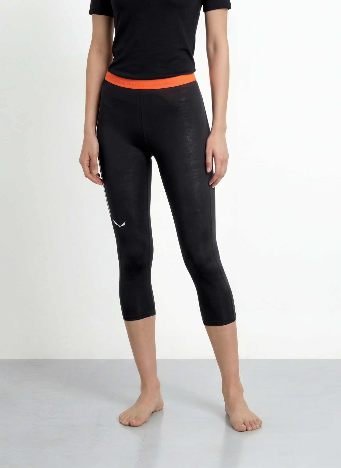 SALEWA Pantalon fonctionnel CRISTALLO en laine mérinos, longueur raccourcie: NOIR / ORANGE FLUO