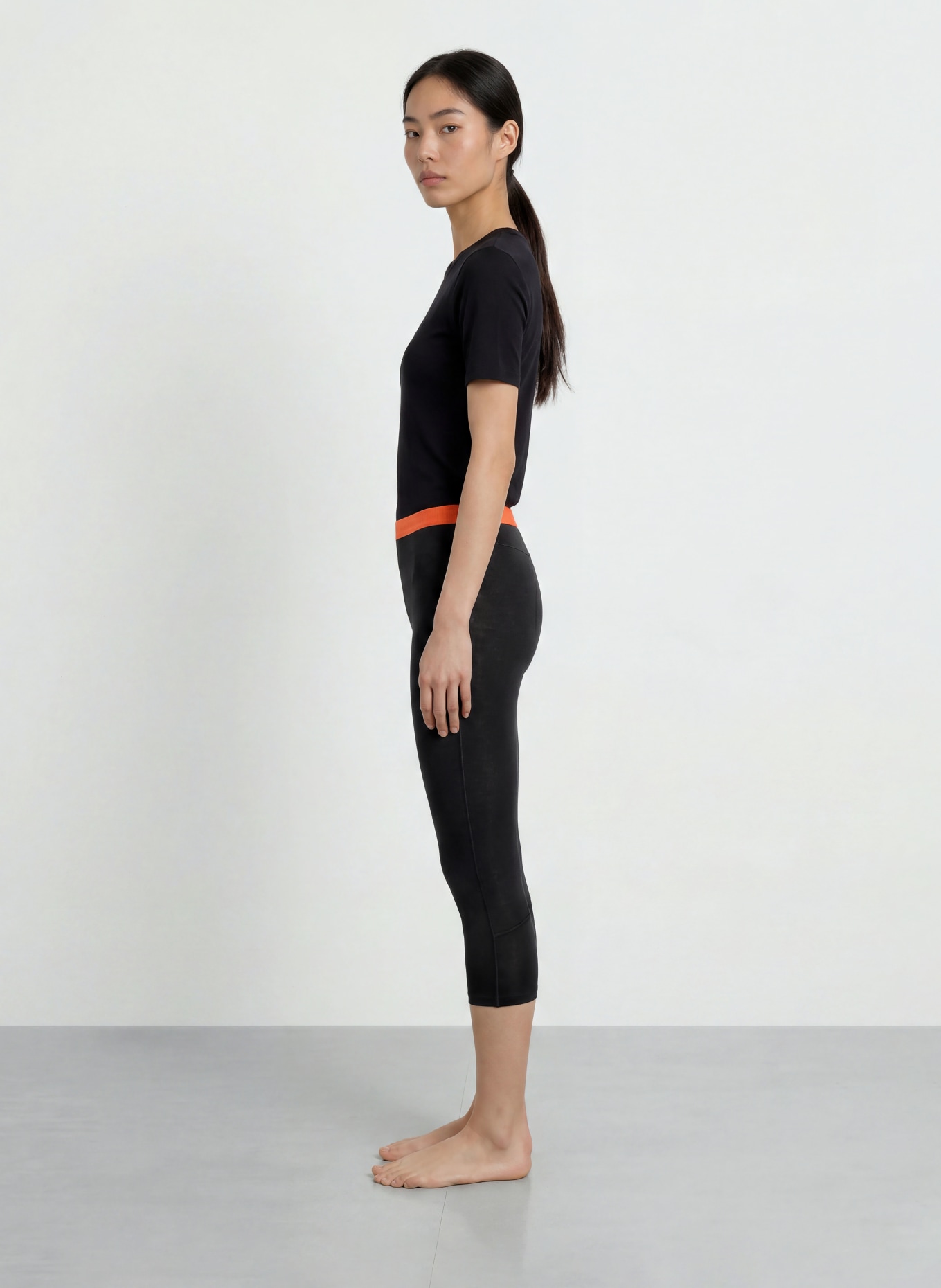 SALEWA Pantalon fonctionnel CRISTALLO en laine mérinos, longueur raccourcie: NOIR / ORANGE FLUO