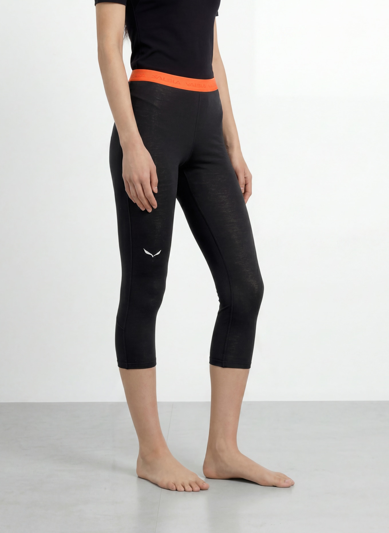 SALEWA Pantalon fonctionnel CRISTALLO en laine mérinos, longueur raccourcie: NOIR / ORANGE FLUO