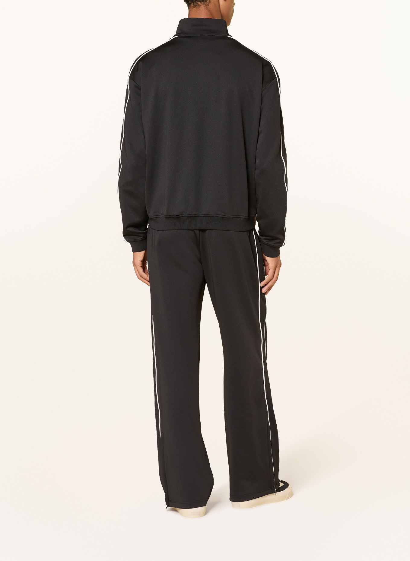 REPRESENT Track pants with braided stripes: BLACK / WHITE