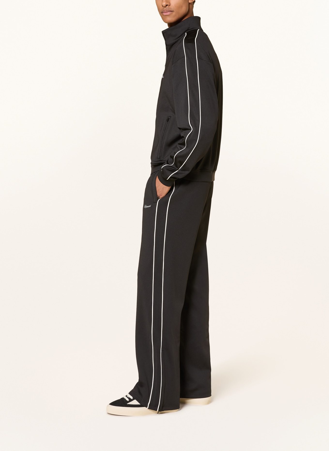 REPRESENT Track pants with braided stripes: BLACK / WHITE