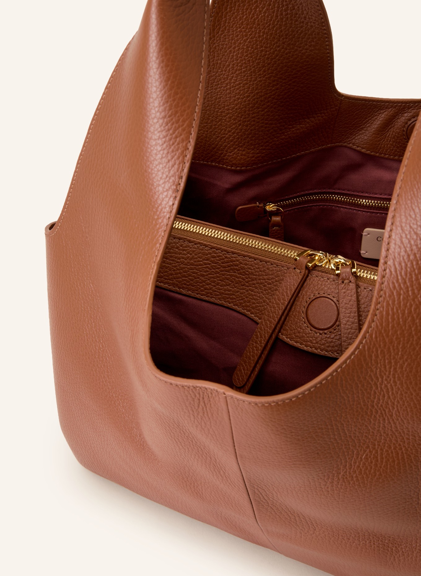 COCCINELLE Buideltas: COGNAC