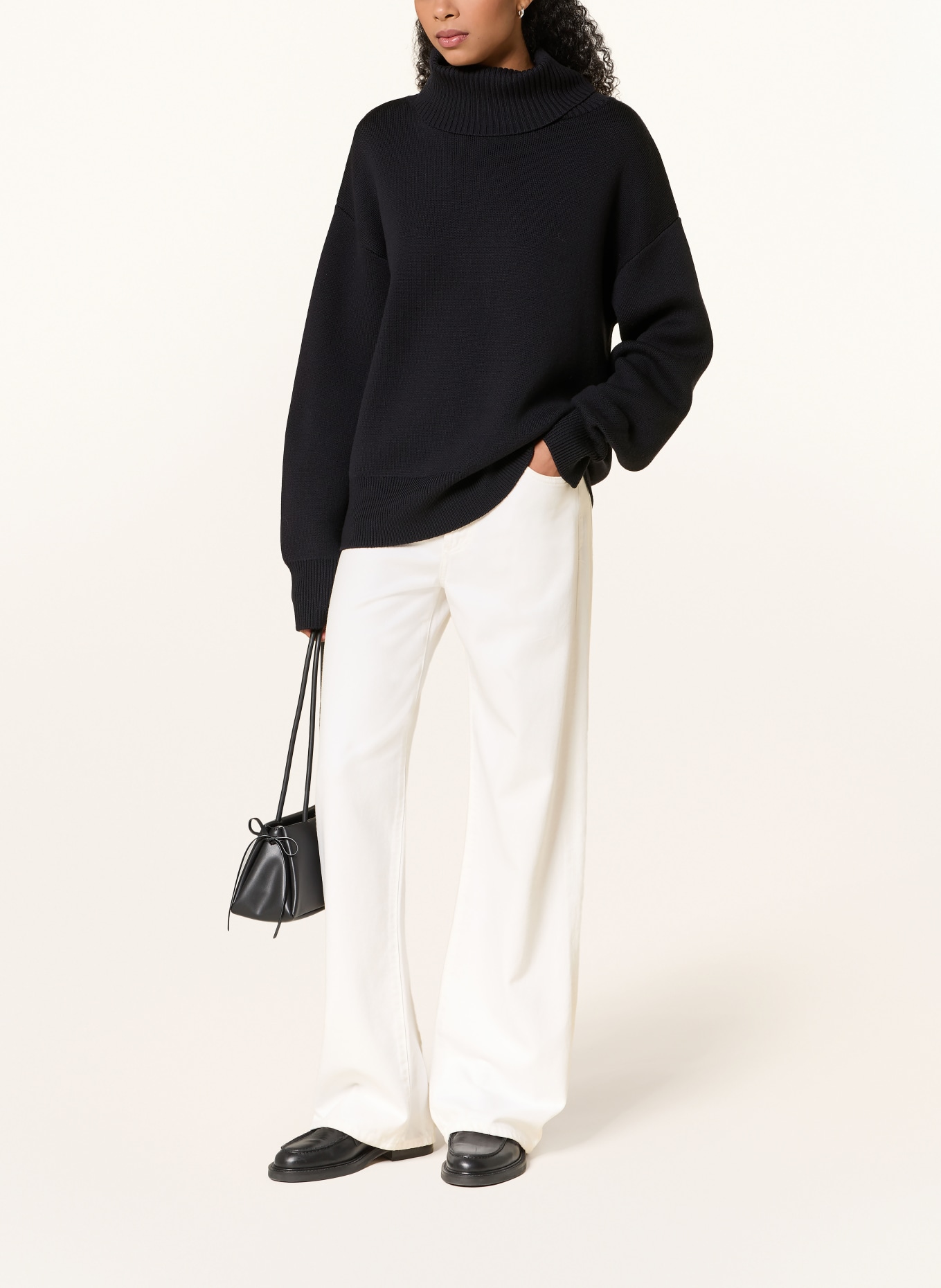Rhea. Turtleneck Sweater: BLACK