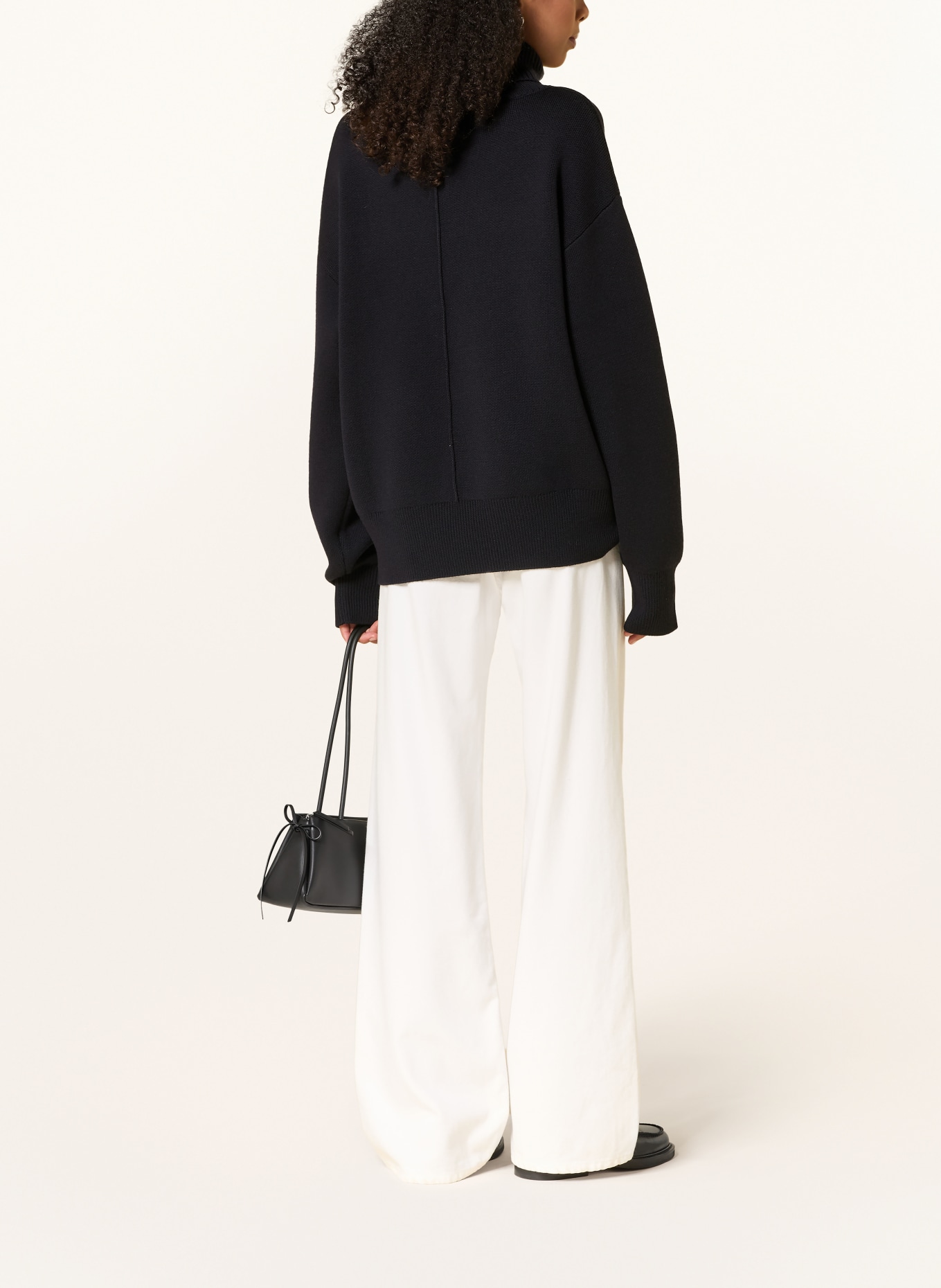 Rhea. Turtleneck Sweater: BLACK