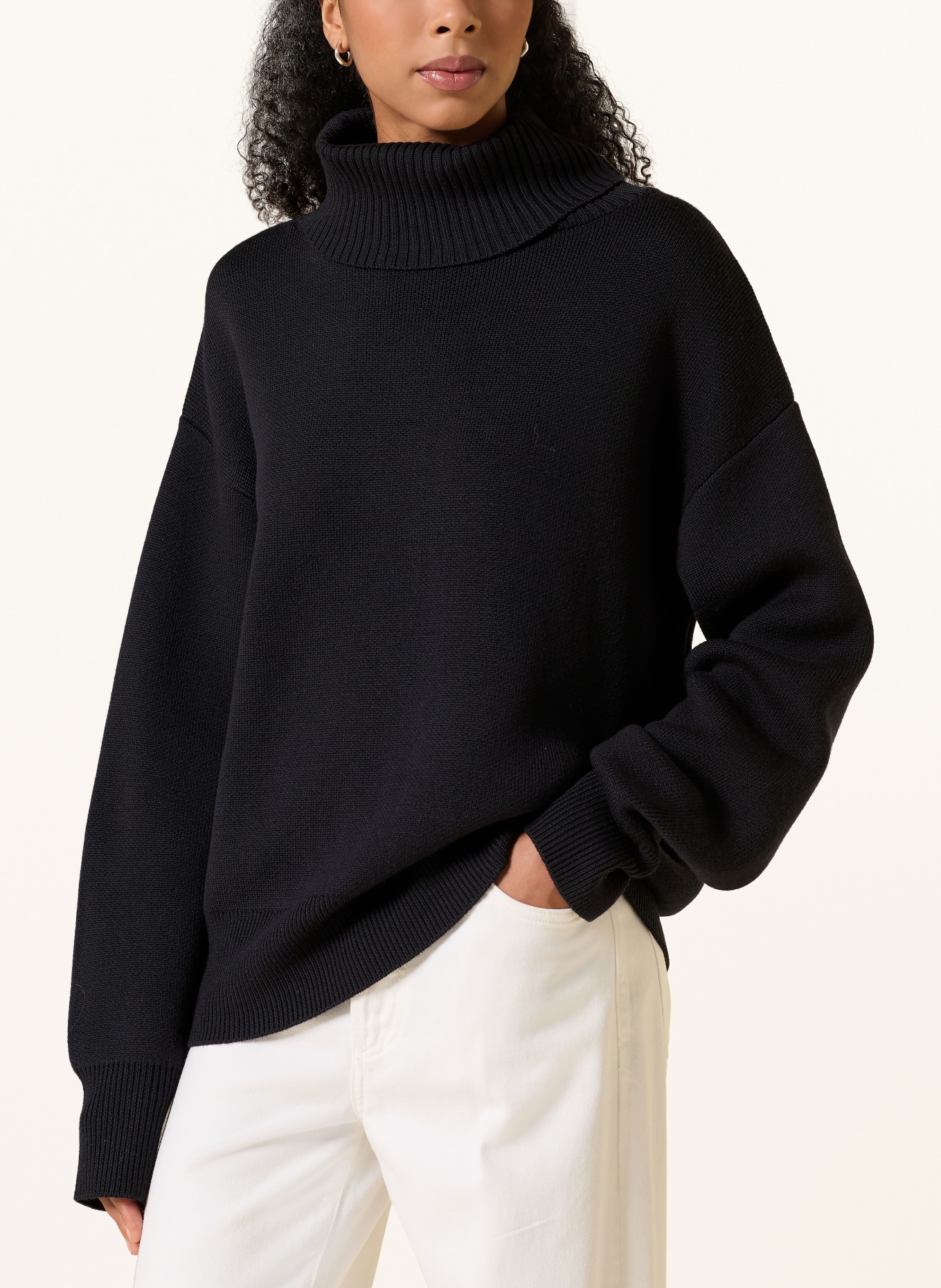 Rhea. Turtleneck Sweater: BLACK