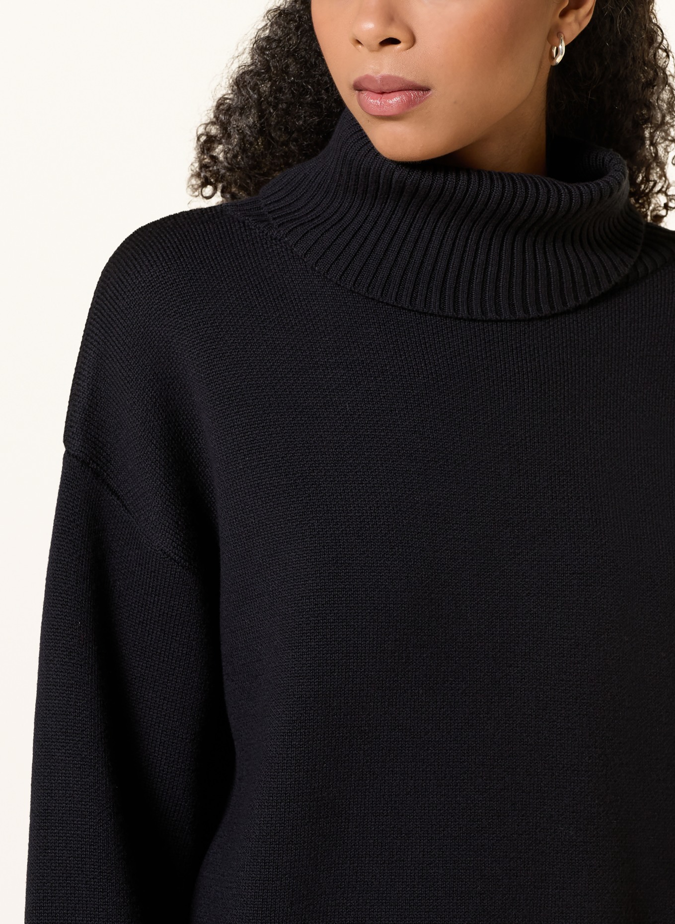 Rhea. Turtleneck Sweater: BLACK