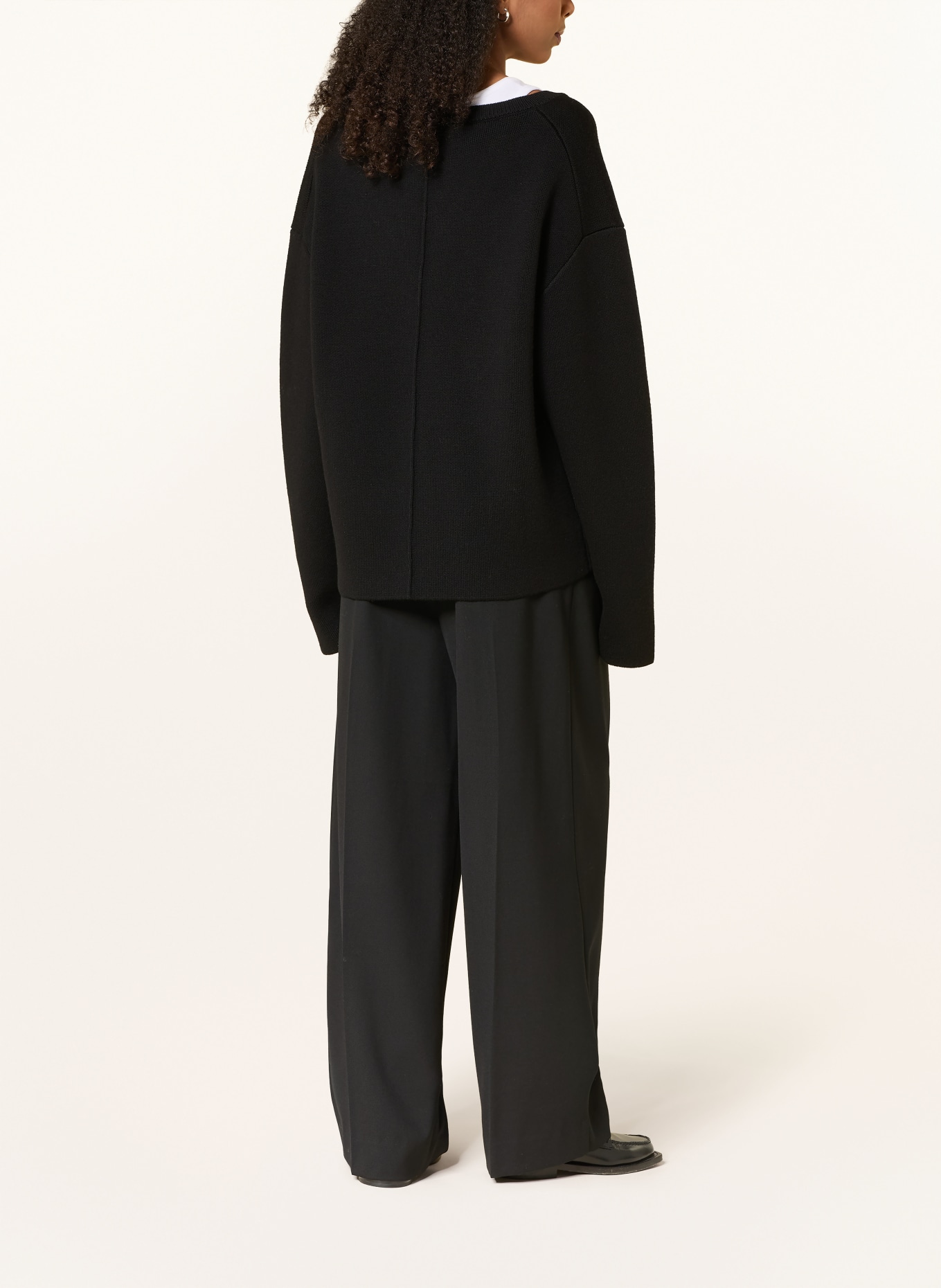 Rhea. Sweater: BLACK